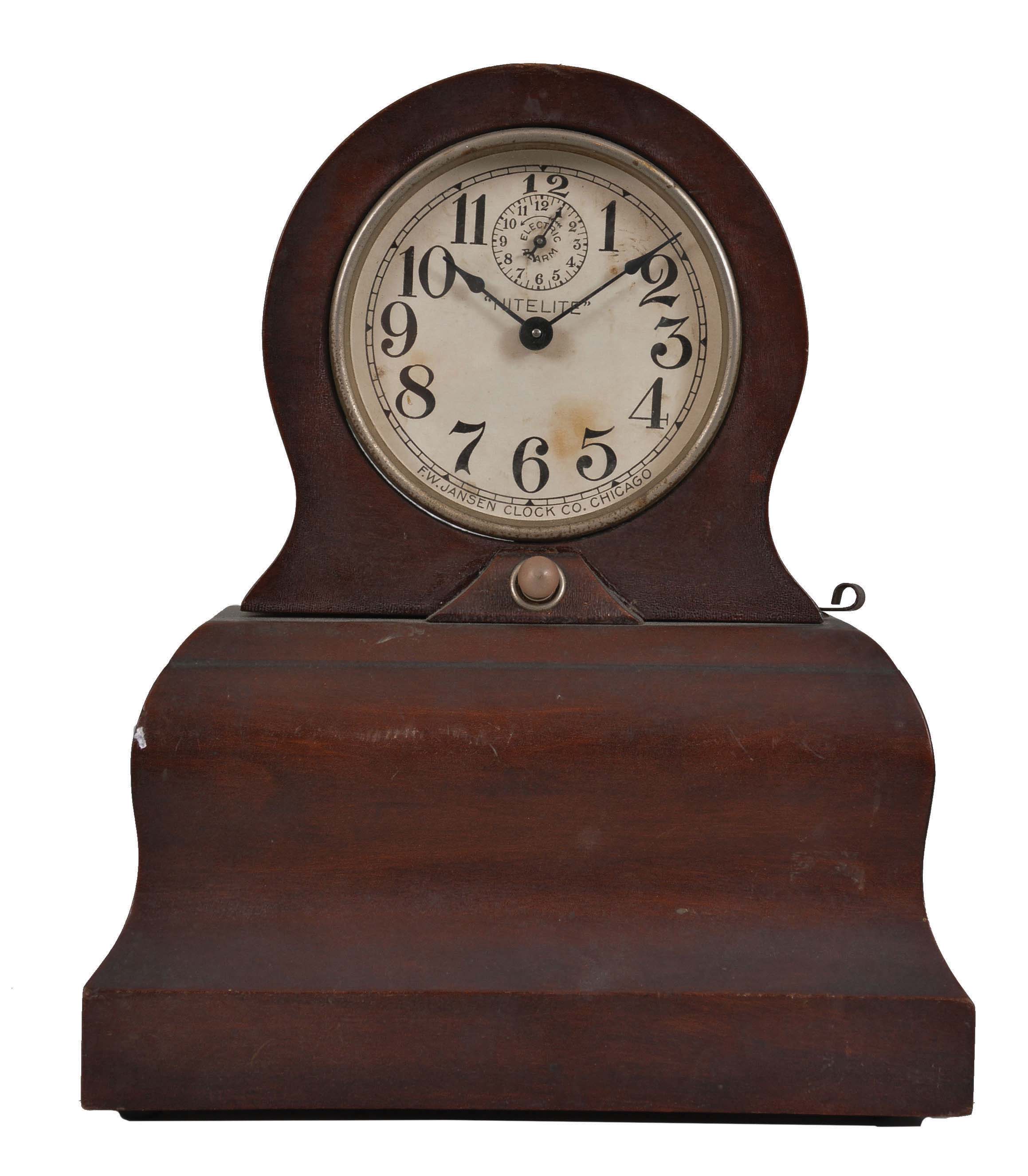 Clocks- 5 (Five) Illuminated Clocks: unusual spring-driven clocks illuminated by small flashlight bulbs. Models include Darche Mfg. Co., Chicago, IL, "Flashlight" and "Searchlight" alarm novelty clocks, Jansen "Nitelite" as well as models by Waterbury and New Haven. — Antique Clocks Price Guide