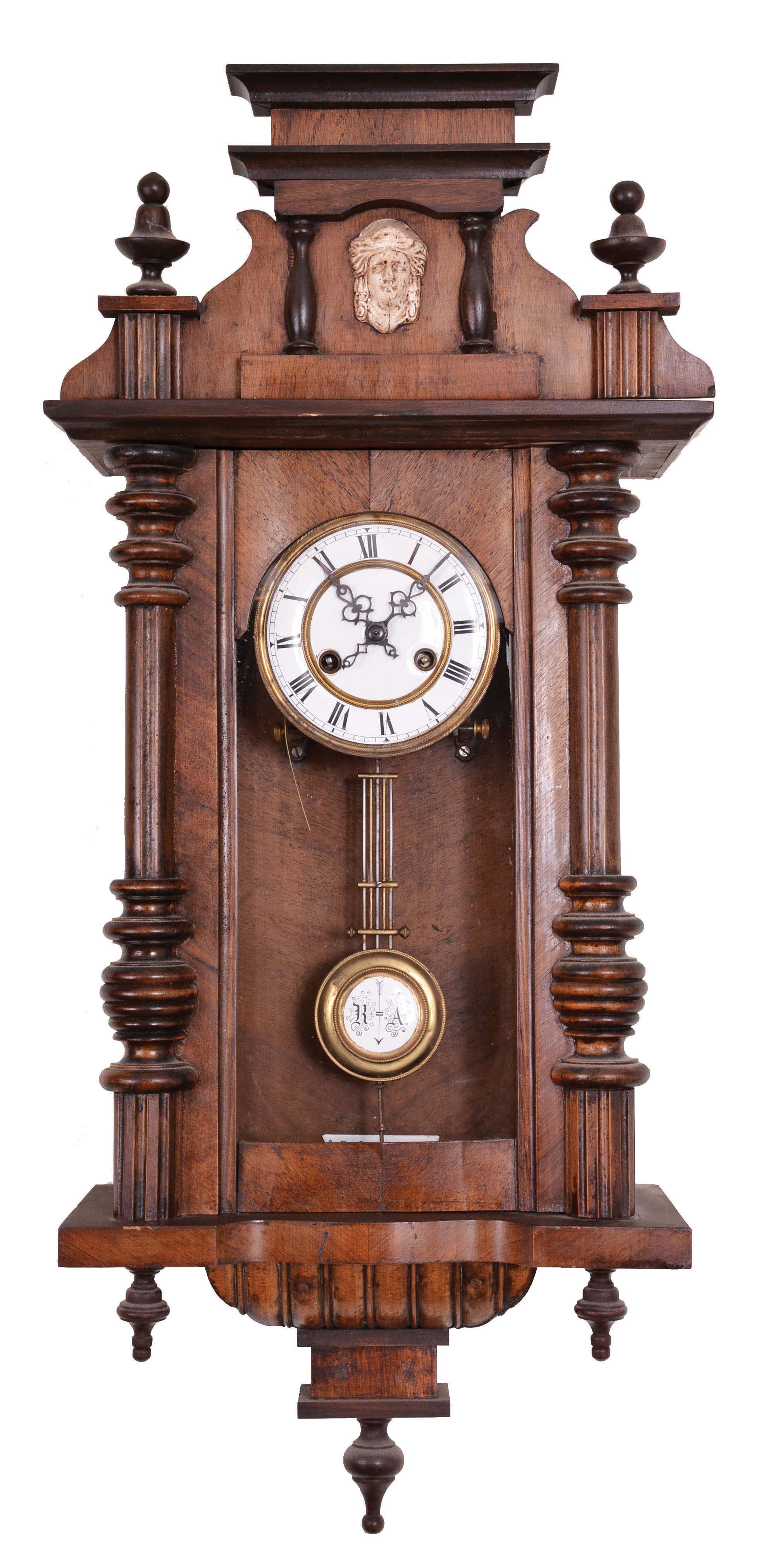 Clocks- 3 (Three) German RA Clocks: three RA clocks, 8 day, time and strike, spring-driven movements in walnut cases with top crests and turned finials by Friedrich Mauthe, Schlenker & Kienzle, and one other unsigned. — Antique Clocks Price Guide