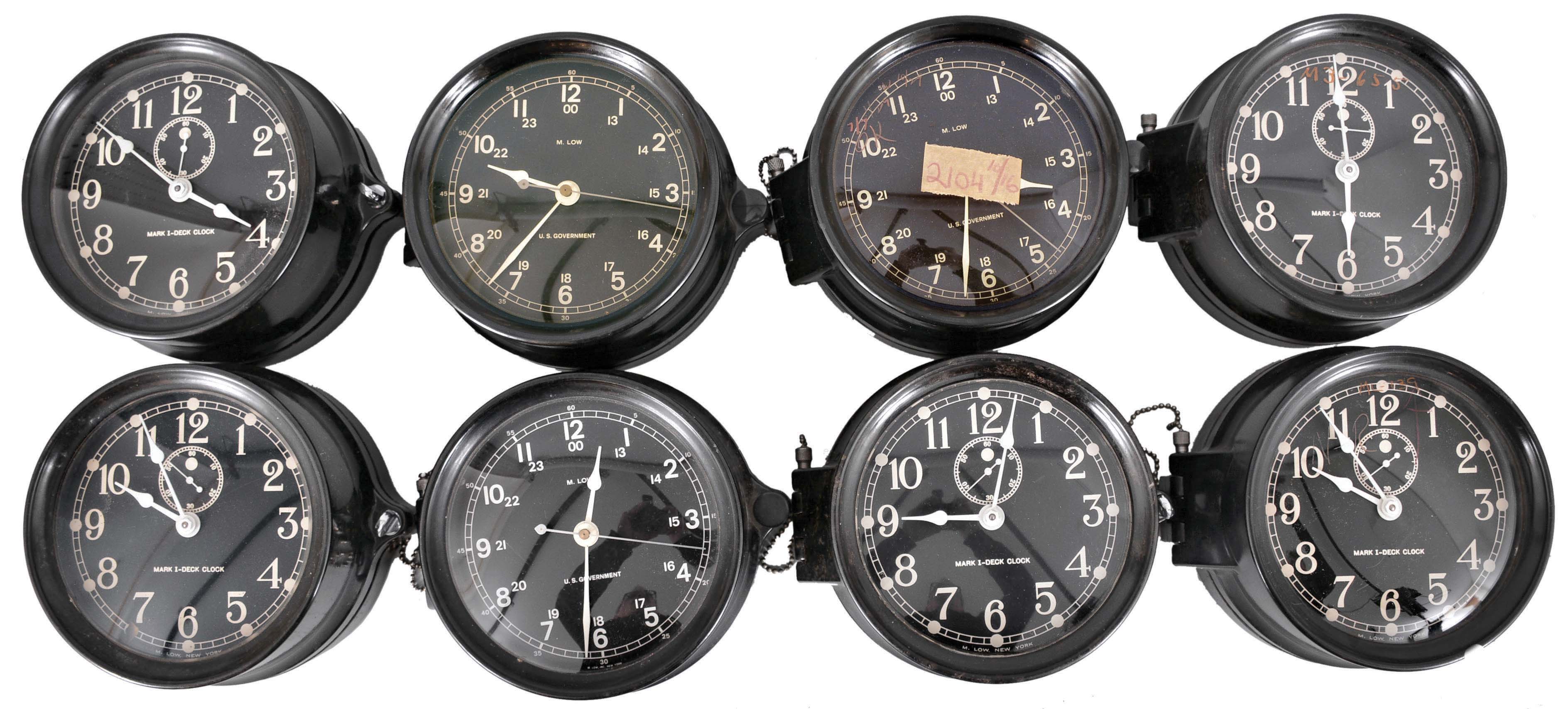 Clocks- 16 (Sixteen) Marine Clocks: M. Low, New York, for U.S. Government, "Mark I- Deck Clocks" and wardroom timepieces, 8 day, time only, spring-driven balance wheel movements with rear wind in black plastic cases with black dials, hinged bezels, and wall mounting plates. — Antique Clocks Price Guide