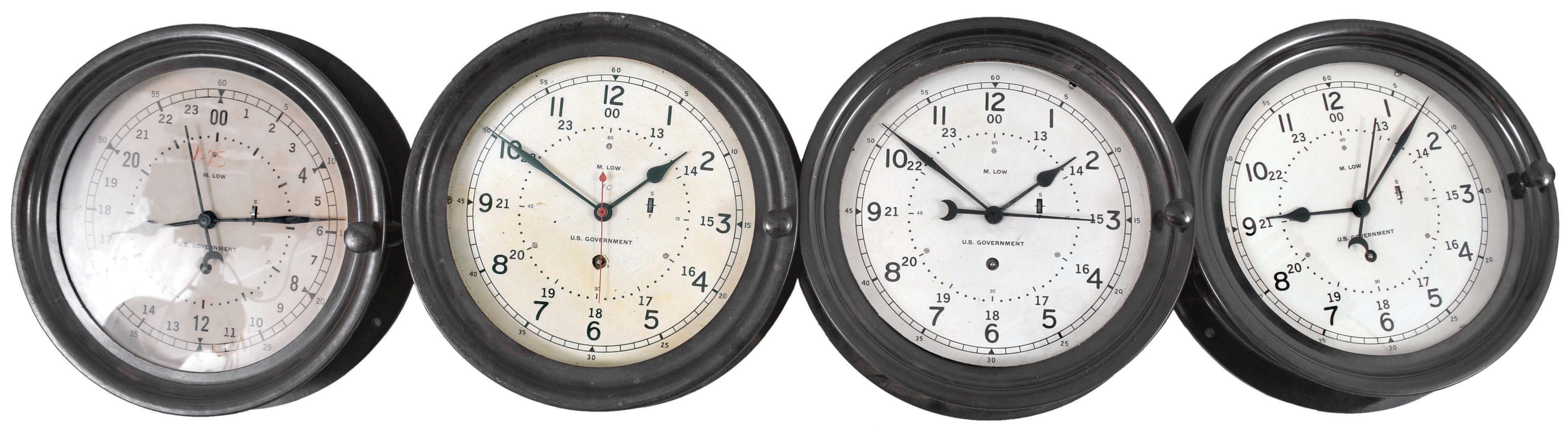 Clocks- 7 (Seven) Deck or Engine: M. Low, New York, for U.S. Government, deck or engine room timepieces, 8 day, time only, spring-driven balance wheel movements in black phenolic cases with hinged bezels, 8.5 inch white dials showing 12 and 24 hours with center seconds. Two extra dials are included. — Antique Clocks Price Guide