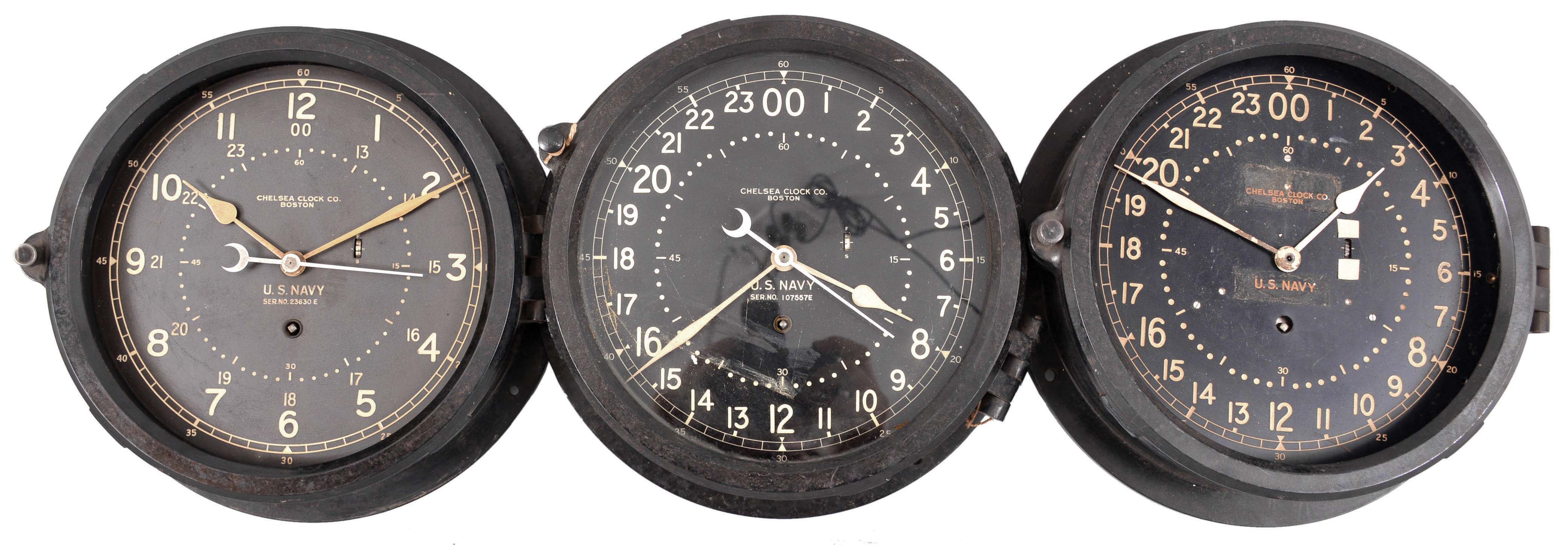 Clocks- 6 (Six) Chelsea Engine Room Clocks: Chelsea Clock Co., Boston, Mass., for the U.S. Navy, "Deck & Engine Room" clocks, 8 day, time only, spring-driven balance wheel movements with center seconds in black phenolic cases with hinged bezels, 8.5 inch black dials showing both 12 and 24 hours. — Antique Clocks Price Guide
