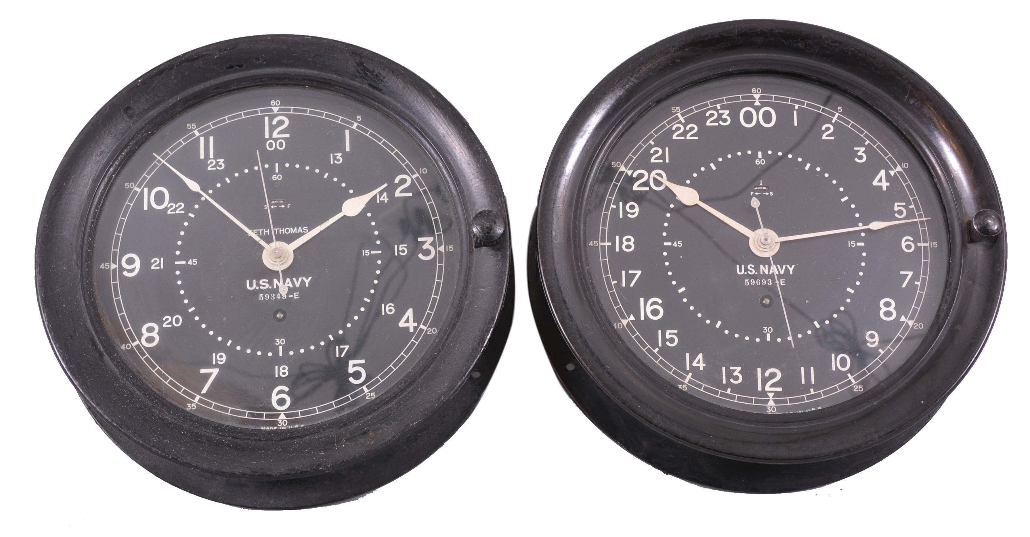 Clocks- 2 (Two) Seth Thomas Deck or Engine Room: Seth Thomas Clock Co., Thomaston, Conn., for U.S. Navy, deck or engine room clocks, 8 day, time only, spring-driven balance wheel movements in black phenolic cases with 8.5 inch black dials, one showing 24 hours and the other showing both 12 and 24 hours, center seconds displayed on an inner ring. — Antique Clocks Price Guide