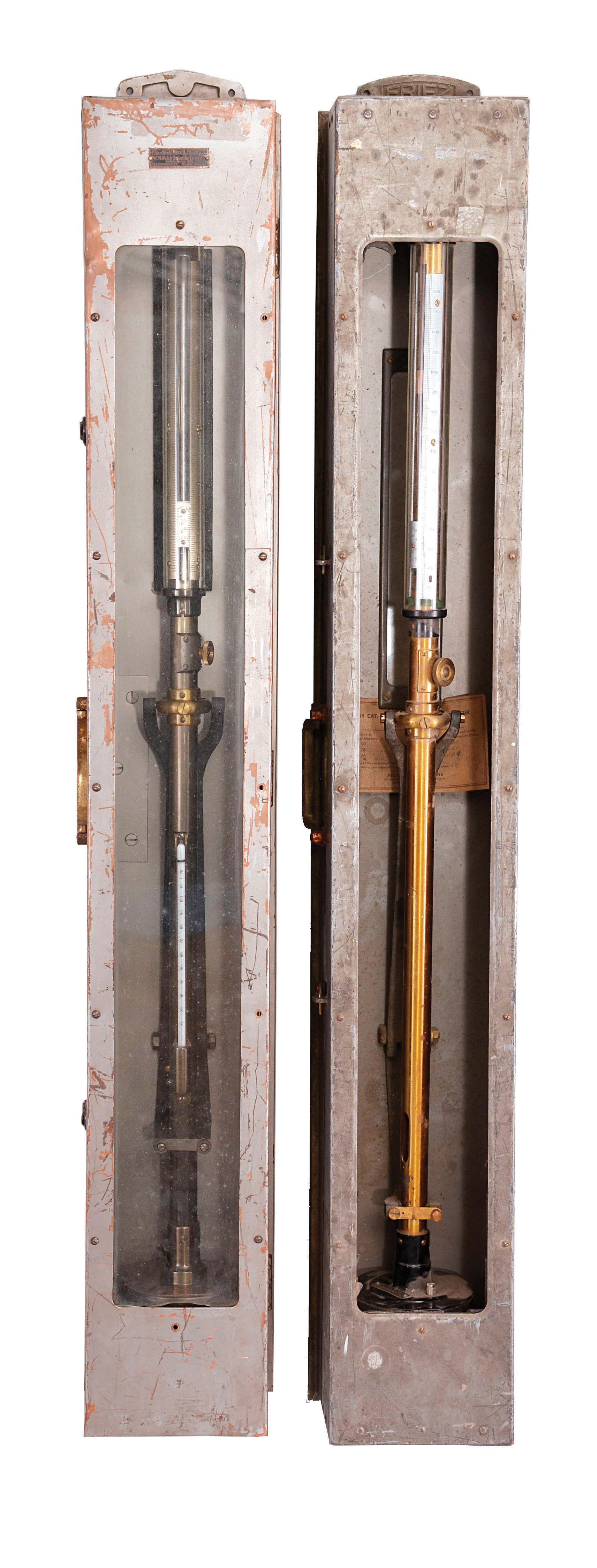 Barometers- 2 (Two) World War II era gimbal-mounted mercurial barometers for U.S. Navy Bureau of Ships: (1) Julian P. Friez, Baltimore, Maryland, brass body, mounted in a gray painted brass box, Navy tag dated 1942. (2) W. M. Welch Scientific Company, Chicago, Illinois, brass body with thermometer, mounted in a gray painted copper box, Navy tag dated 1943. — Antique Clocks Price Guide