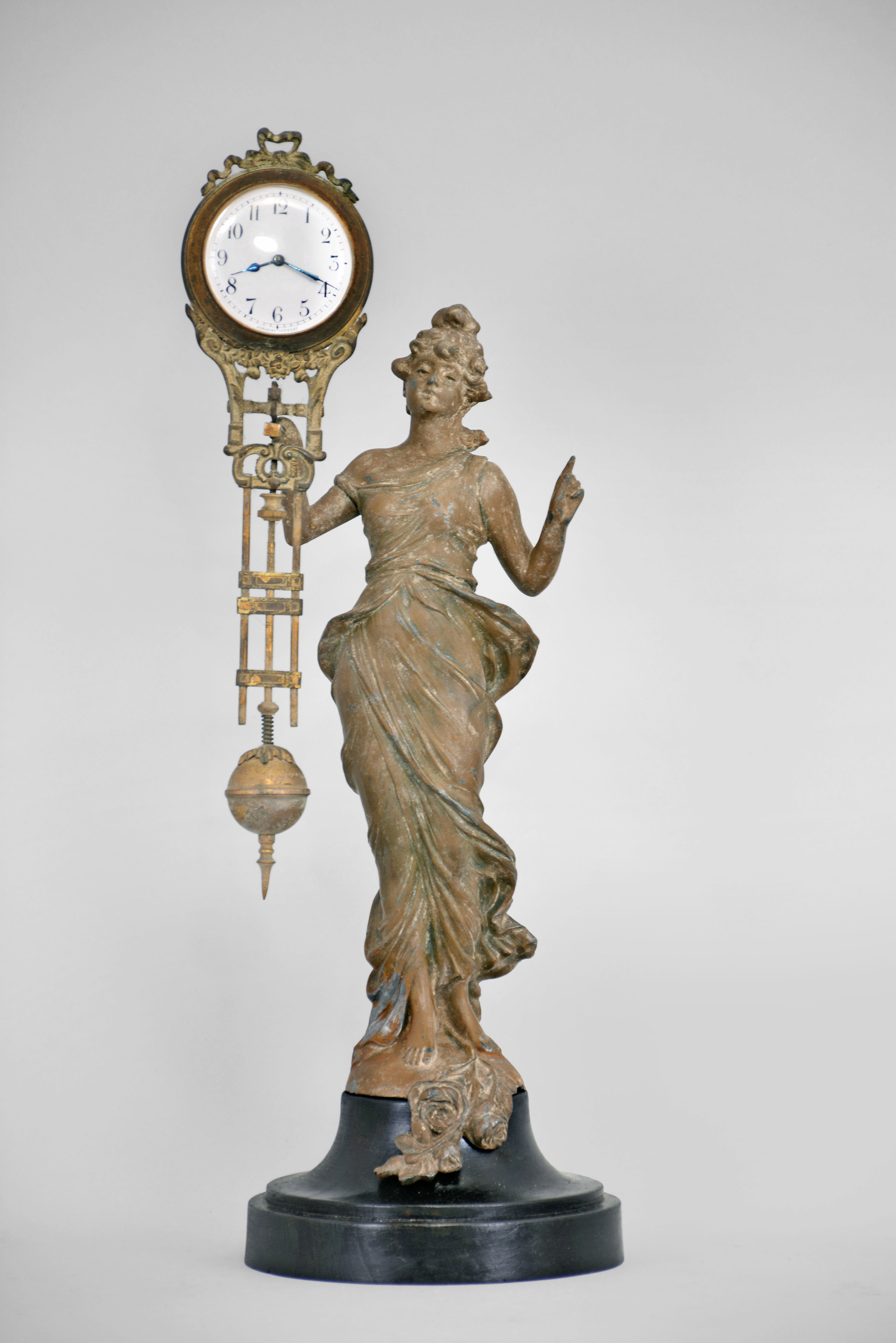 German, Junghans "Diana" figural 8 day, cast metal swinging arm novelty time-only mantel clock. — Antique Clocks Price Guide