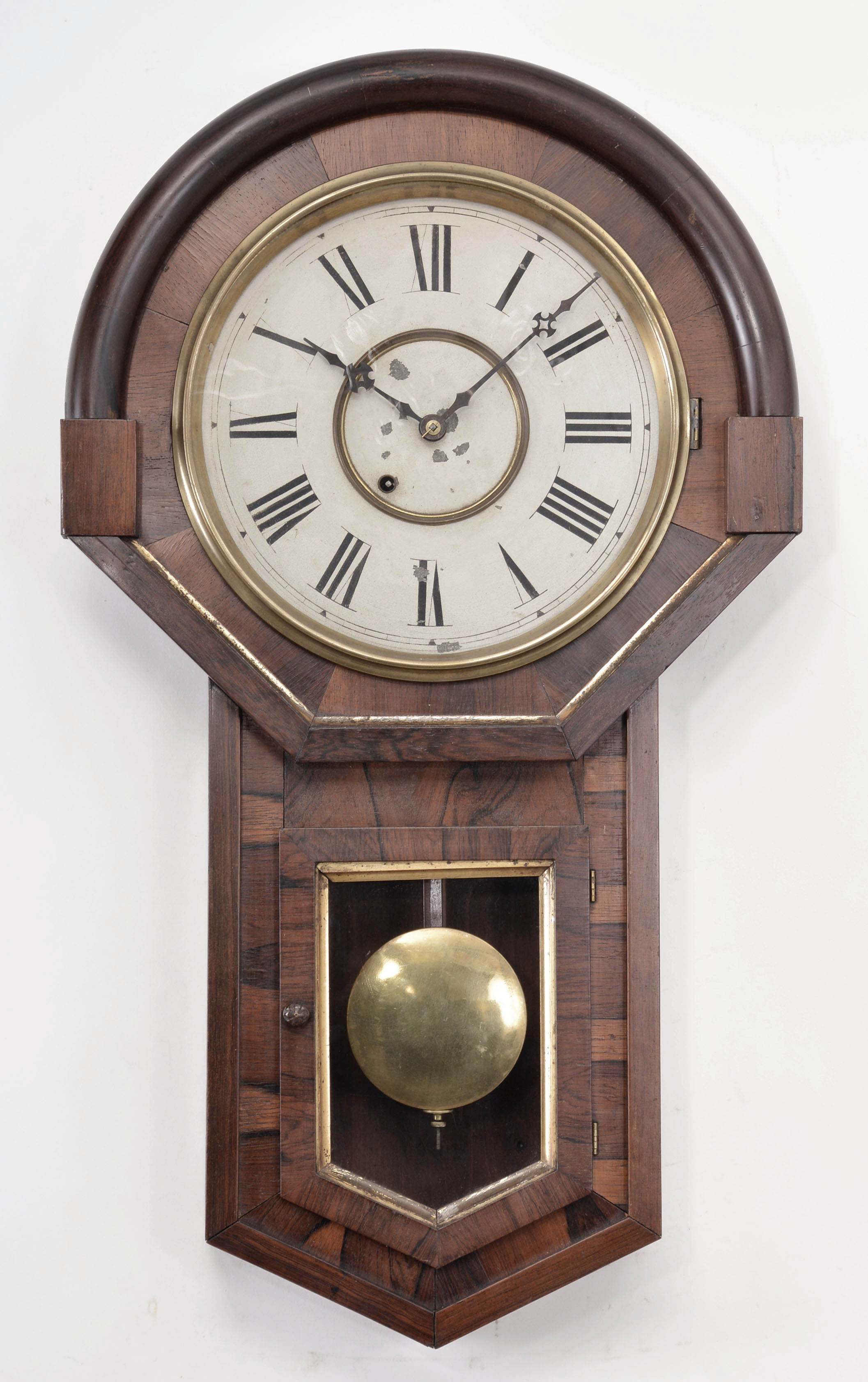 New Haven Clock Co., New Haven, Conn., "Imperial" wall clock, 8 day, time only, spring driven movement in a rosewood veneered case with painted metal dial. — Antique Clocks Price Guide