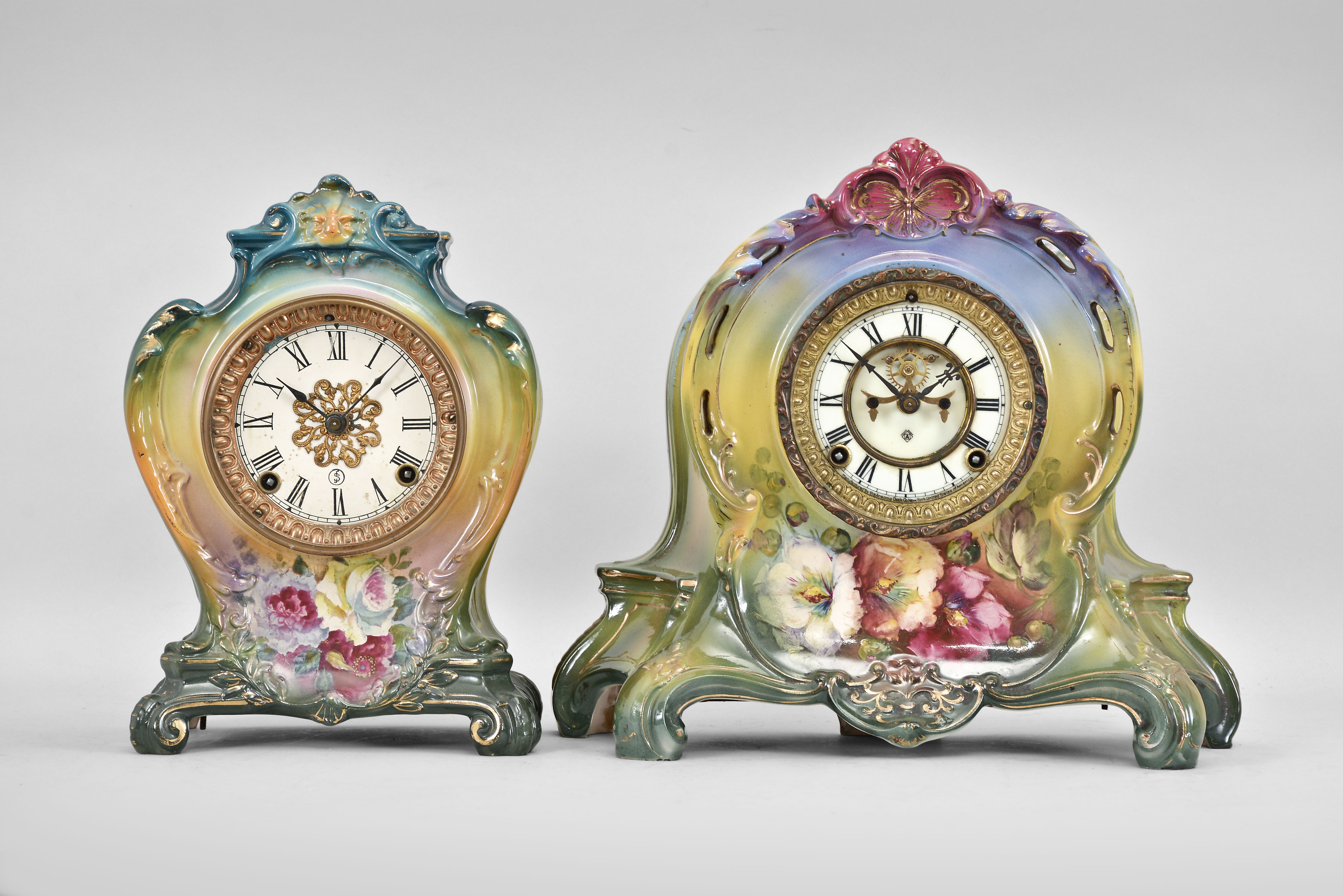 Clocks- 2 (Two) Ansonia Clock Co., New York, 8 day, time and strike, spring driven movements: (1) "La Plaine" with a polychrome porcelain Royal Bonn case, c1904; (2) "La Layon" with visible escapement in polychrome Royal Bonn case, c1904. — Antique Clocks Price Guide