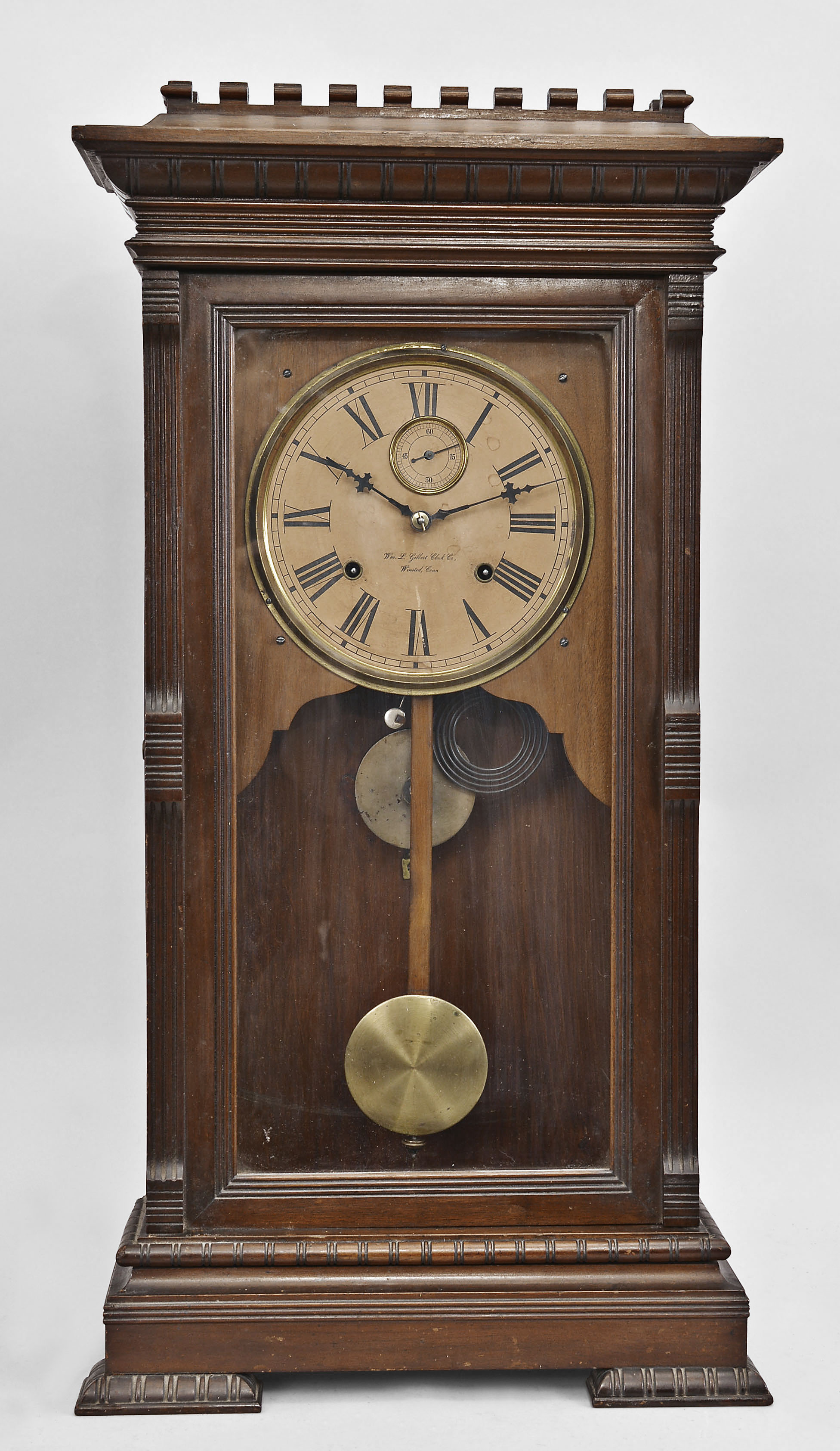 Wm. L. Gilbert Clock Co., Winsted, Conn., "Latona" mantel clock, 8 day, time and strike, spring driven movement in a walnut case. — Antique Clocks Price Guide