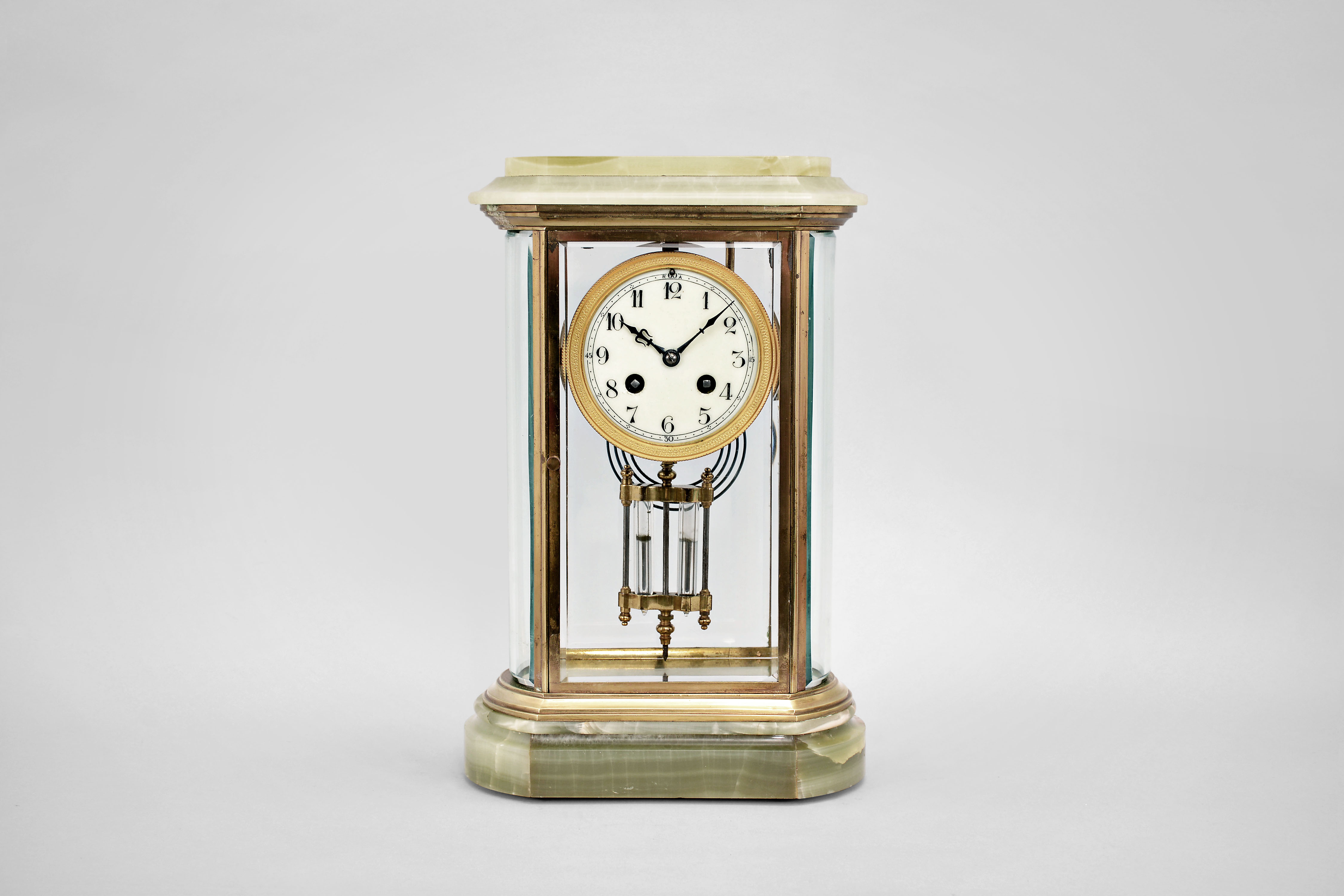 Japy Freres & Cie, Paris, crystal regulator, 8 day, time and strike, spring driven pendule de Paris movement with compensating pendulum in a green onyx case with flat beveled glasses front and back and curved beveled glass on both sides, gilt bezel holding a porcelain dial with numerals, blued steel hands. — Antique Clocks Price Guide