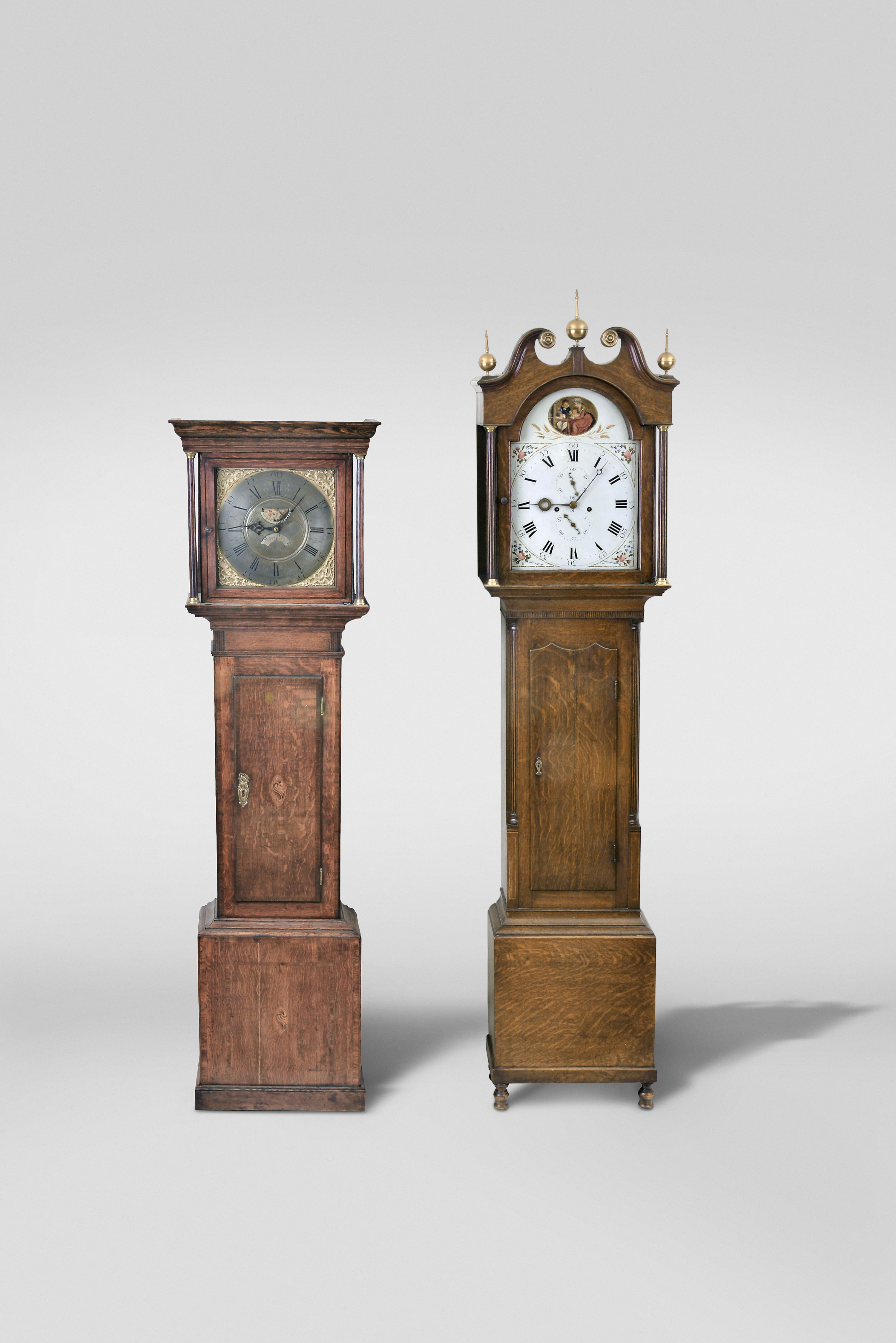 Tall Clocks- 2 (Two) English & Scottish: (1) Thomas Lister, Halifax, Yorkshire, 30 hour, time and strike, weight driven movement in an oak case with flat top and square brass dial with moon phase and calendar, c. 1780; (2) 8 day, time and strike weight driven movement in an oak case with broken arch top and three brass finials, painted metal dial and unique hands, hour hand signed Thonas Blackwood, Bridgend, Perth, Scotland, c. 1810. — Antique Clocks Price Guide