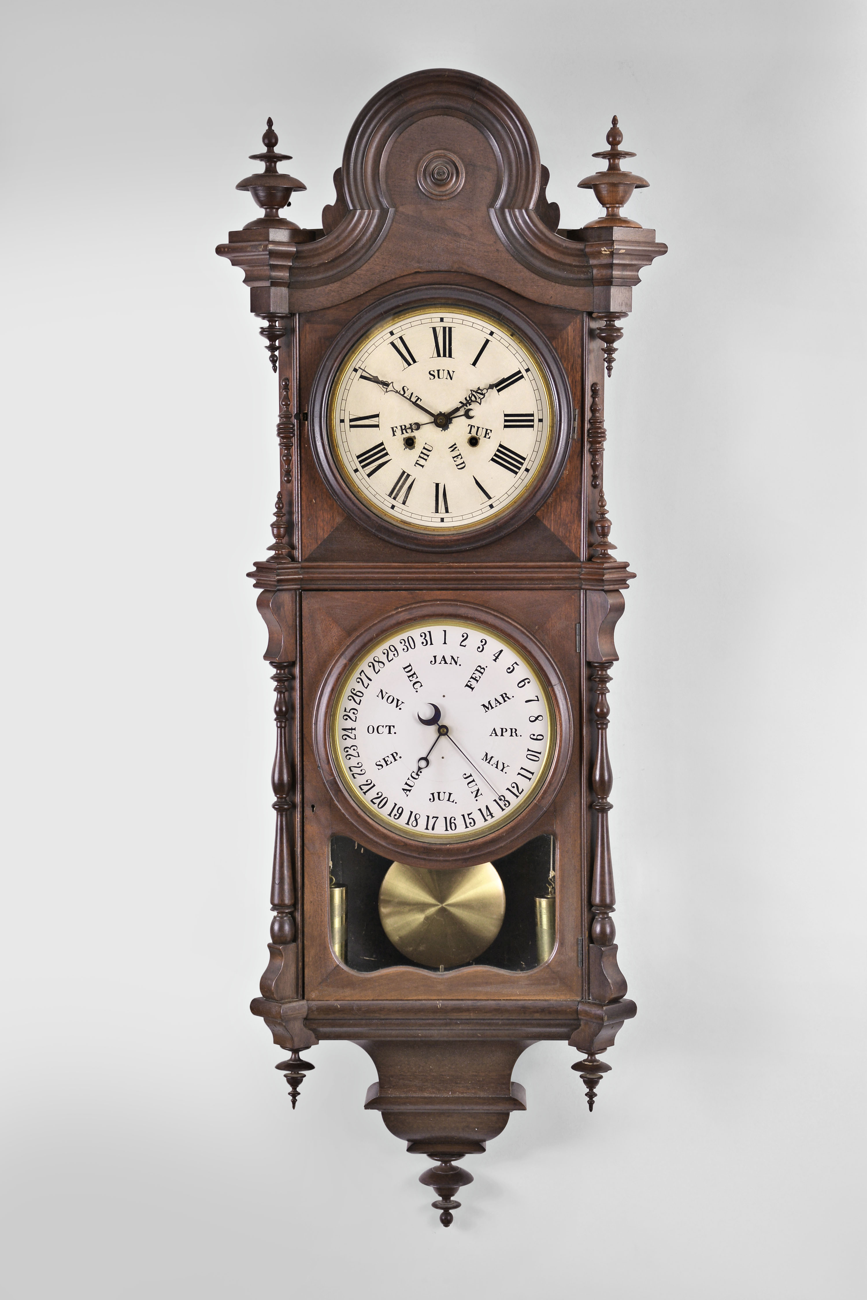 Welch, Spring & Co., Forestville, Conn., "No. 3 Regulator B. W." hanging clock with a double weight driven 8 day timepiece movement and a B. B. Lewis patented perpetual calendar mechanism in a black walnut case. — Antique Clocks Price Guide