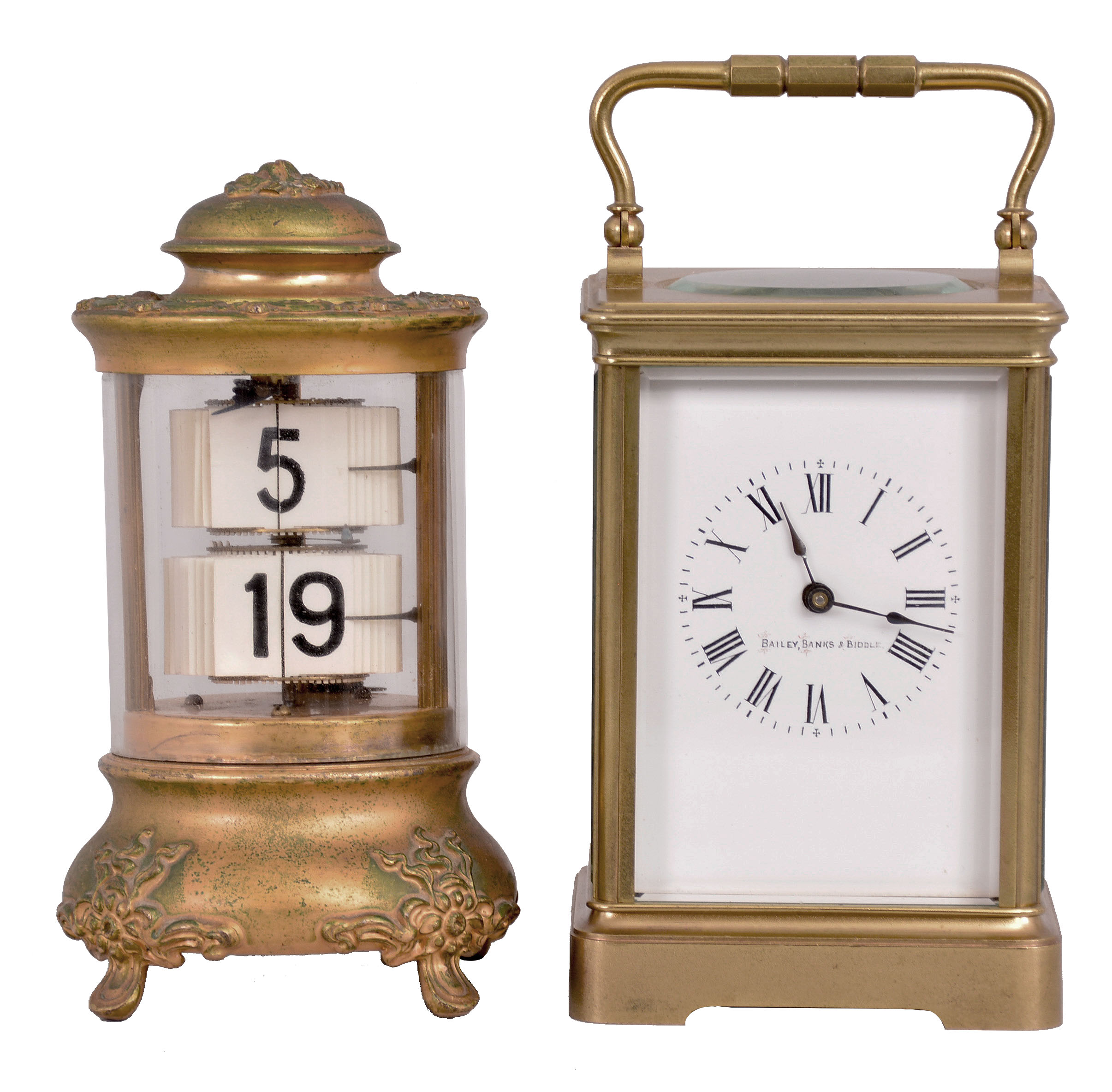 Clocks- 2 (Two): (1) Ansonia Clock Co., New York, "Design No. 4" Plato timepiece, 30 hour, time only, spring driven balance wheel movement in a cylindrical brass and glass case with digital flip-card time display, c1907; (2) Boston Clock Co., Boston, Mass. for Bailey Banks, & Biddle, carriage clock, 8 day, time and strike, tandem-wind spring driven balance wheel movement in a glazed brass case, c1890. — Antique Clocks Price Guide