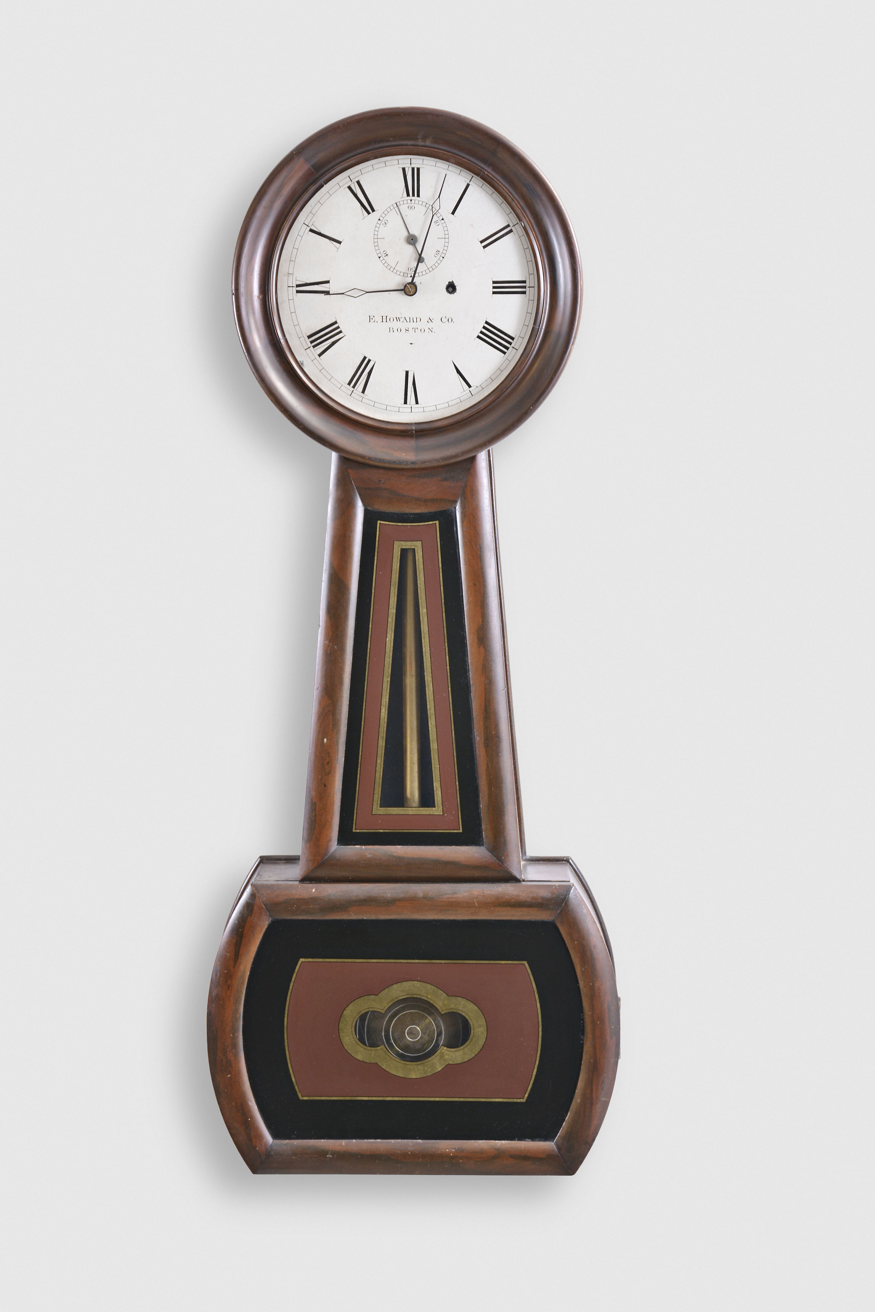 E. Howard & Co., Boston, Mass., "No. 1 Regulator" banjo wall clock, 8 day, time only, weight driven movement in a rosewood grained cherry case with painted metal dial and reverse painted throat and lower tablets — Antique Clocks Price Guide