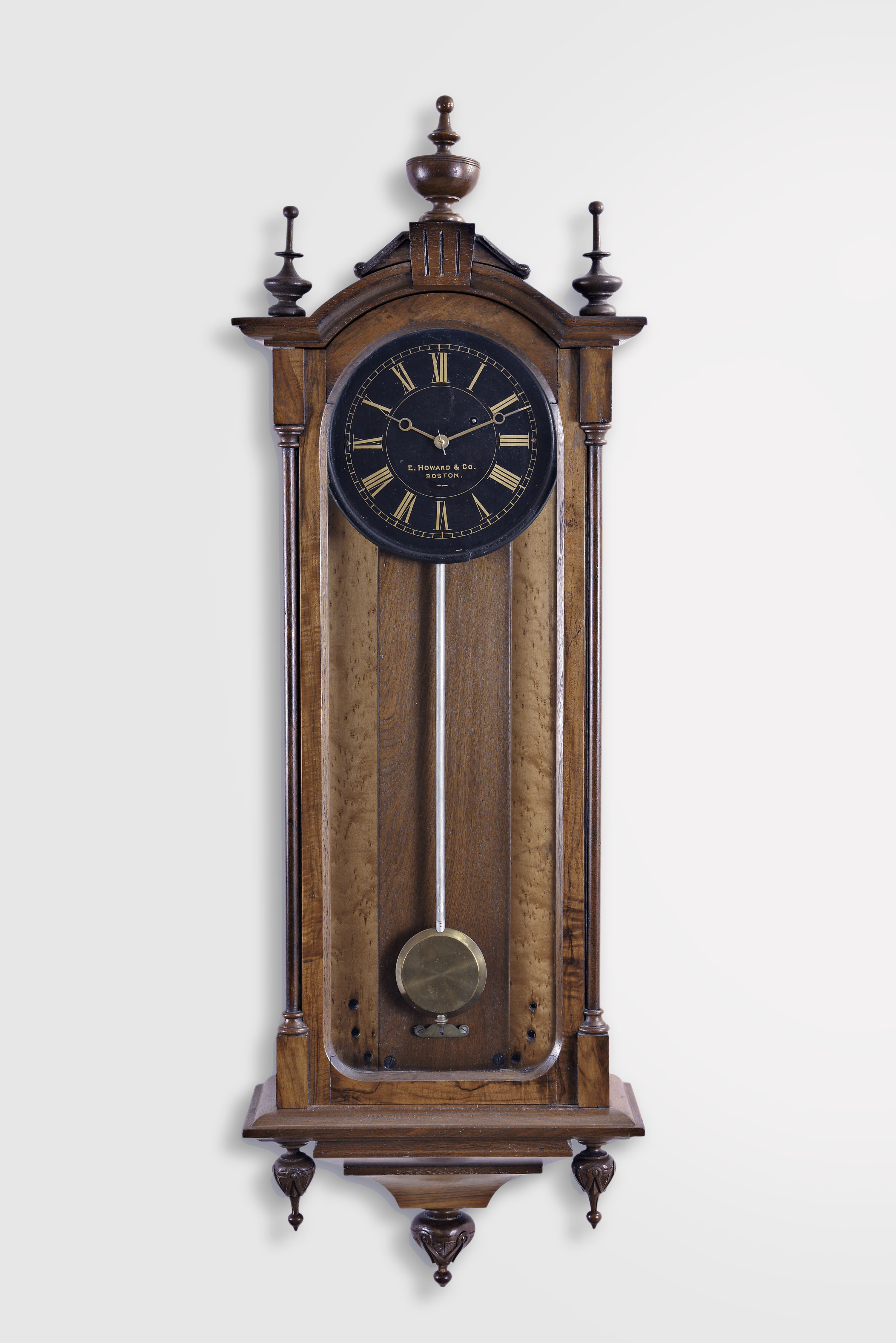 E. Howard & Co., Boston, Mass., "No. 59-8 Regulator" wall clock, 8 day, time only, weight driven movement in a mahogany case with maple backboard and a black painted iron dial with gold numerals and hands — Antique Clocks Price Guide