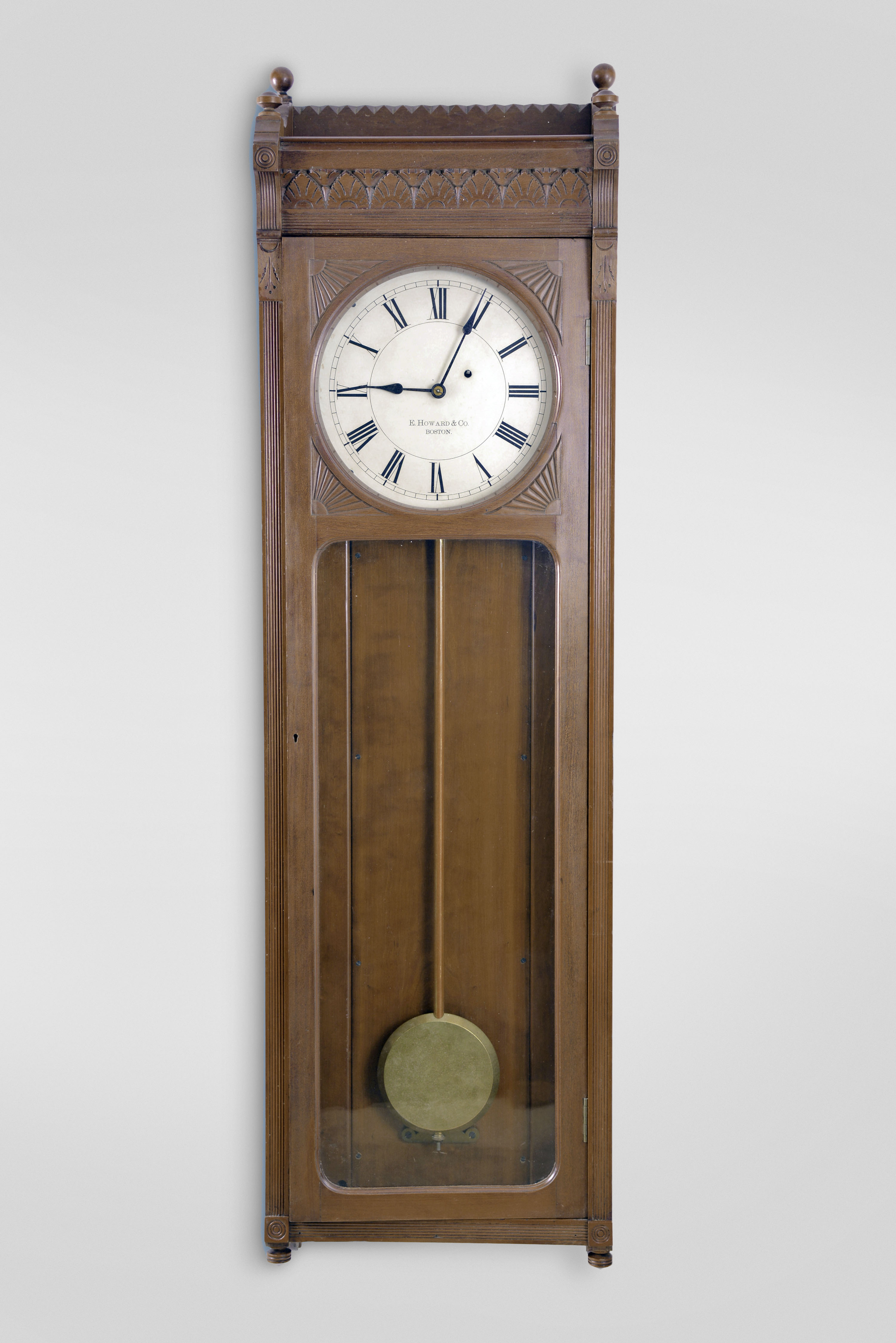 E. Howard & Co., Boston, Mass., RARE "No. 58 Regulator- 12" wall clock, 8 day, time only, weight driven movement in a cherry case with 12" painted metal dial, gold leafed pendulum rod and damascened pendulum bob — Antique Clocks Price Guide