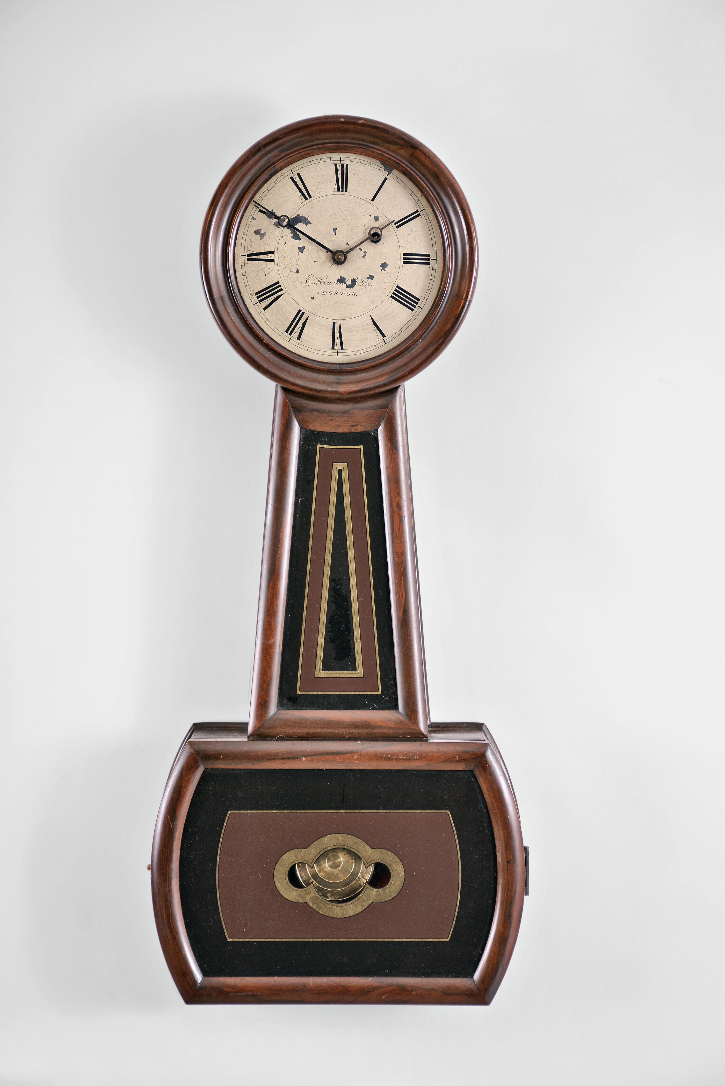 E. Howard & Co., Boston, Mass., "Regulator No. 4", banjo, 8 day, weight brass movement rosewood grained case wall timepiece. Case is stamped "64 ". — Antique Clocks Price Guide