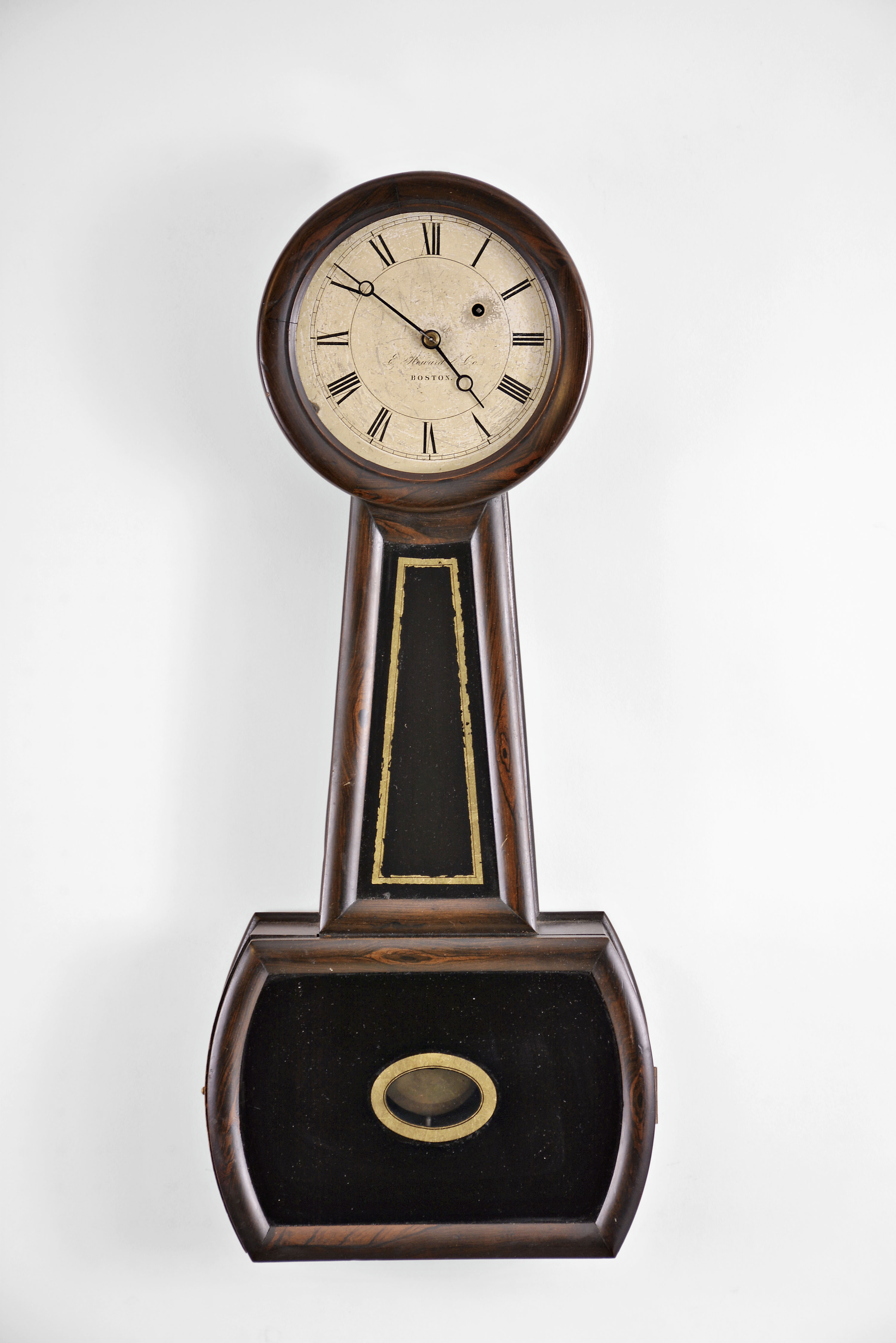 E. Howard & Co., Boston, Mass., "Regulator No. 4", Banjo, 8 day, weight brass movement rosewood grained case wall timepiece. Case is stamped "25 ". — Antique Clocks Price Guide