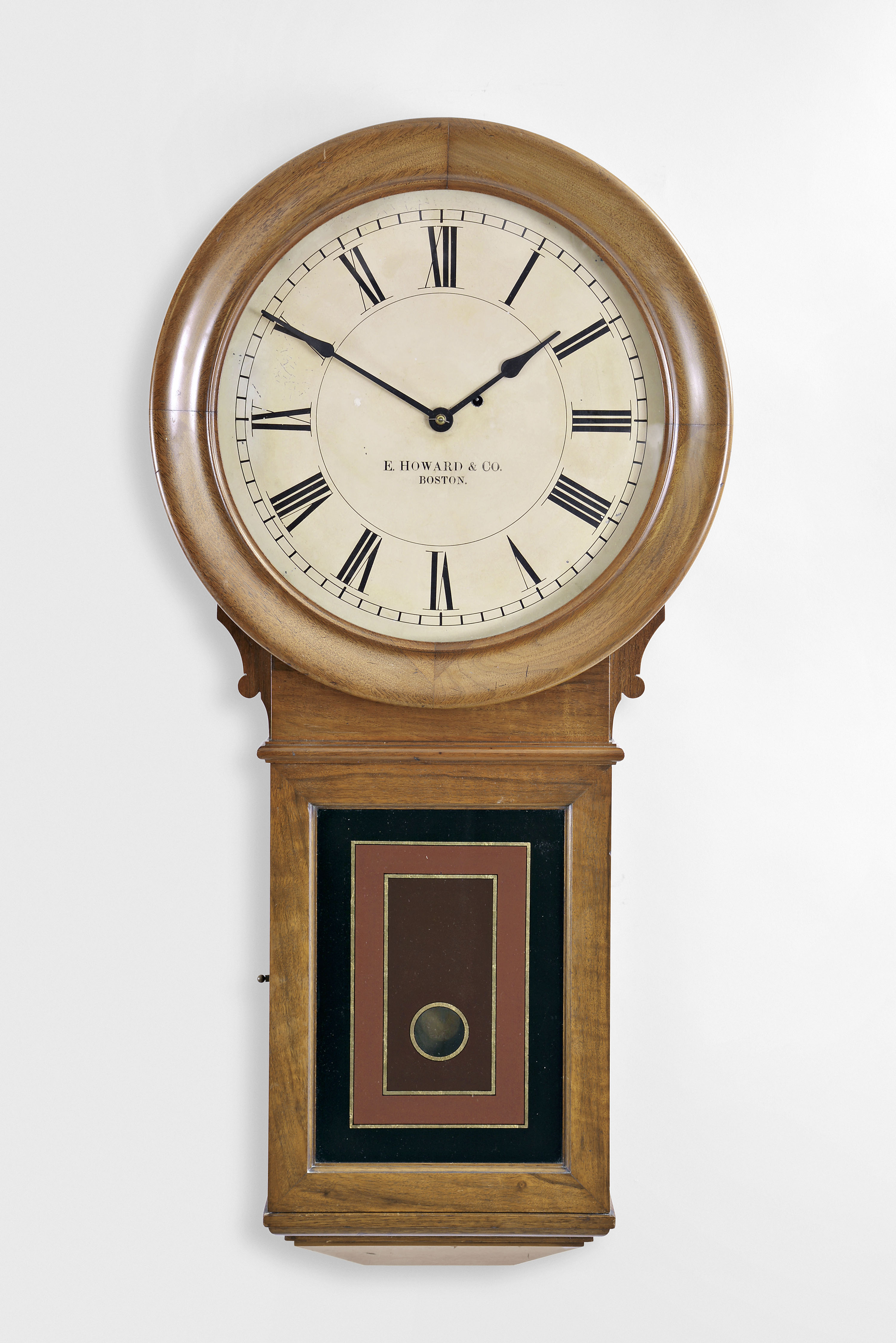 E. Howard & Co., Boston, Mass., "No. 70 Regulator- 16 "- 16" dial wall clock, 8 day, time only, weight driven movement in a walnut case with painted metal dial and reverse painted lower tablet — Antique Clocks Price Guide
