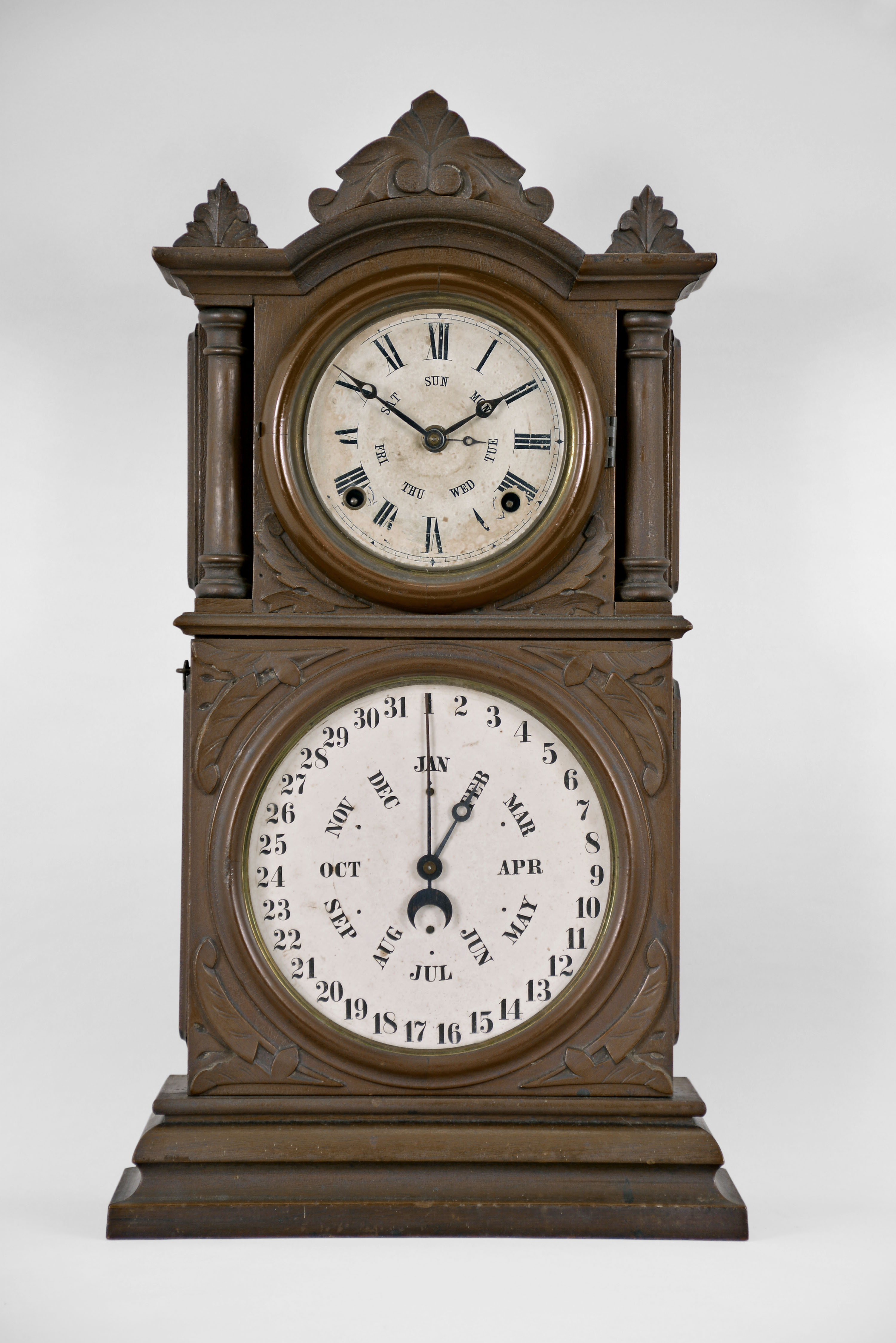 E. Ingraham & Co., Bristol, Conn., "Ingraham Calendar" shelf clock with a spring driven 8 day time and strike movement with a B. B. Lewis patented perpetual calendar mechanism in a walnut case. — Antique Clocks Price Guide