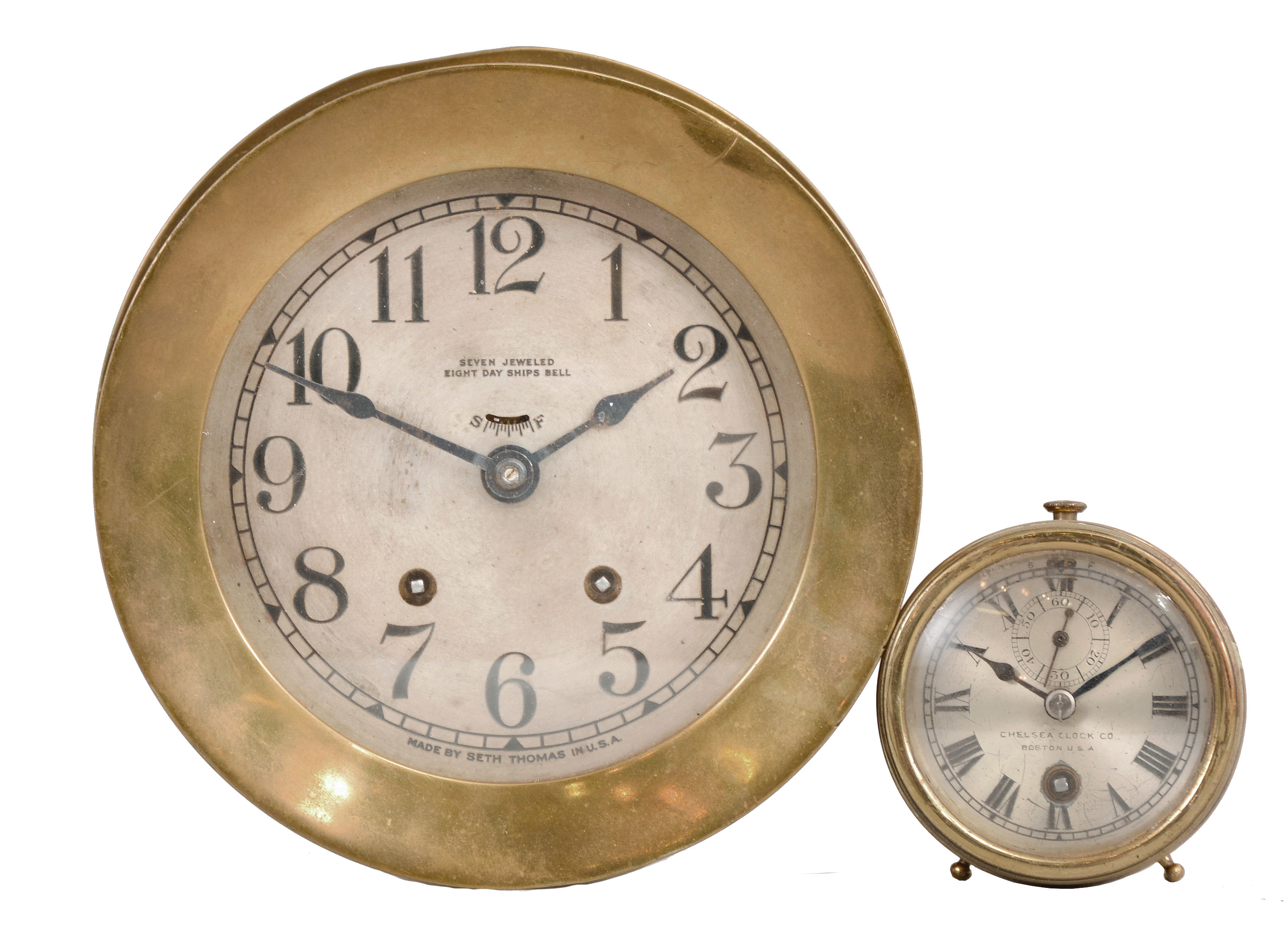 Clocks- 2 (Two): (1) Seth Thomas Clock Co., Thomaston, Conn., "Ship's Bell No. 6" marine clock, 8 day, time and ship's strike, 7-jewel spring driven balance wheel movement in a brass case with screw on bezel and 5.5 inch silvered dial, c1940; (2) Chelsea Clock Co., Boston, Mass., "Special Auto" car clock, 8 day, time only, spring driven jeweled balance wheel movement in a brass case with 2.75 inch silvered dial, c1925. — Antique Clocks Price Guide