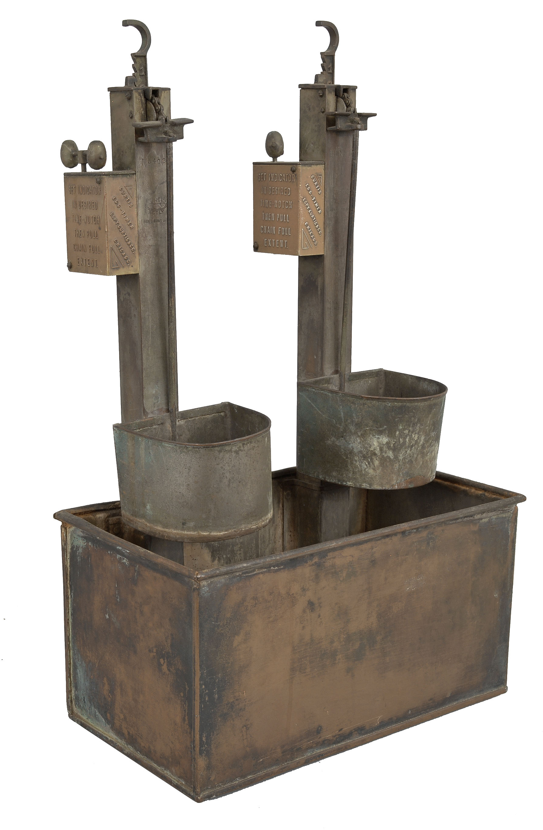 Espy Curtis and Co., Chicago, Illinois, "Curtis Egg Timer" cooking device, two spring driven timers with verge and foliot escapements, copper water vessel, two movement stands, and two egg cooking pans to accommodate six eggs total. — Antique Clocks Price Guide