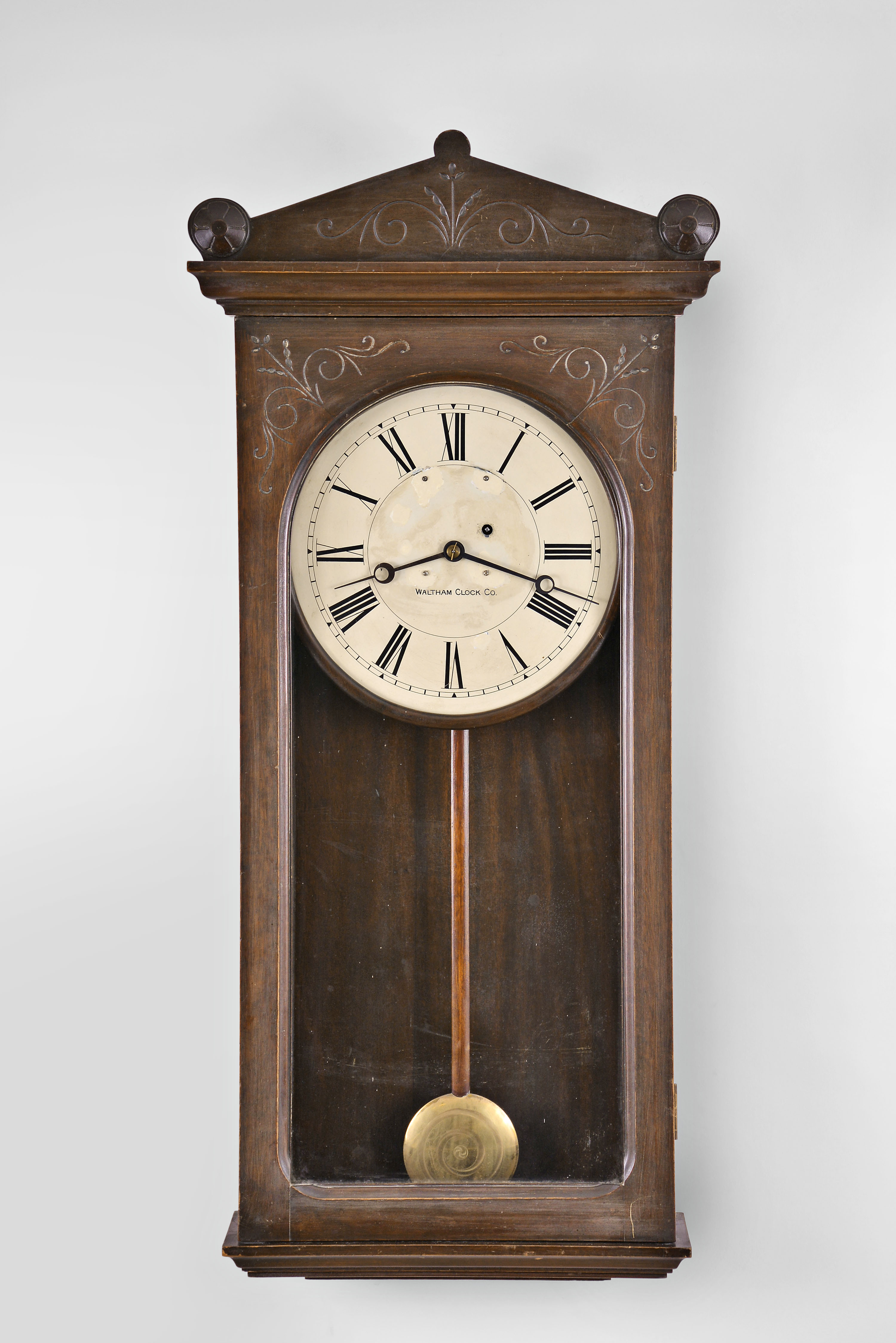 Waltham Clock Co., Waltham, Mass., "Model 35" wall clock with a weight driven 8 day timepiece movement (with deadbeat escapement and maintaining power) in a mahogany case. — Antique Clocks Price Guide