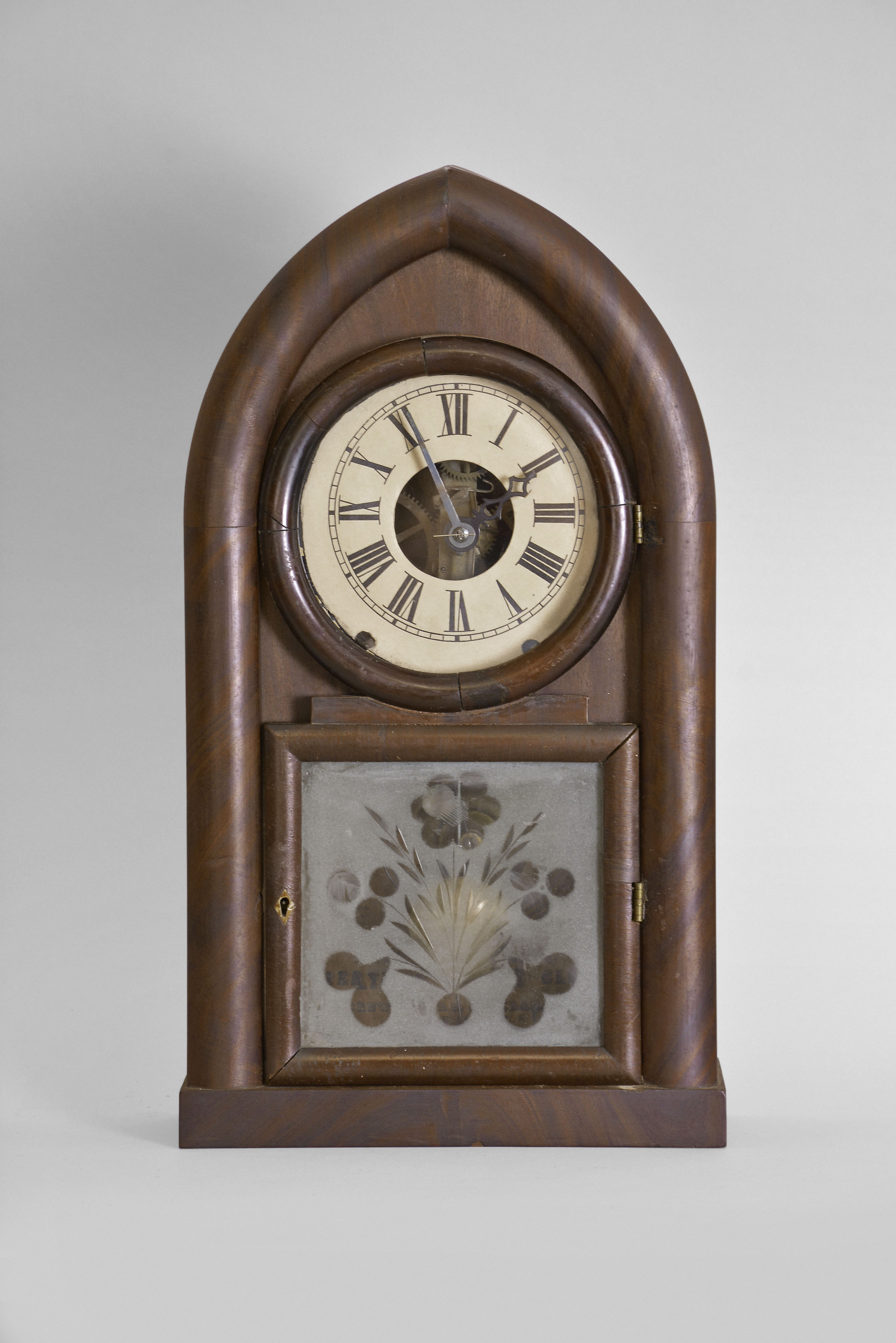 Brewster & Ingrahams, Bristol, Conn., 8 day, time and strike spring brass movement round gothic or beehive shelf clock with rack and snail strike and case iron spring barrels. — Antique Clocks Price Guide