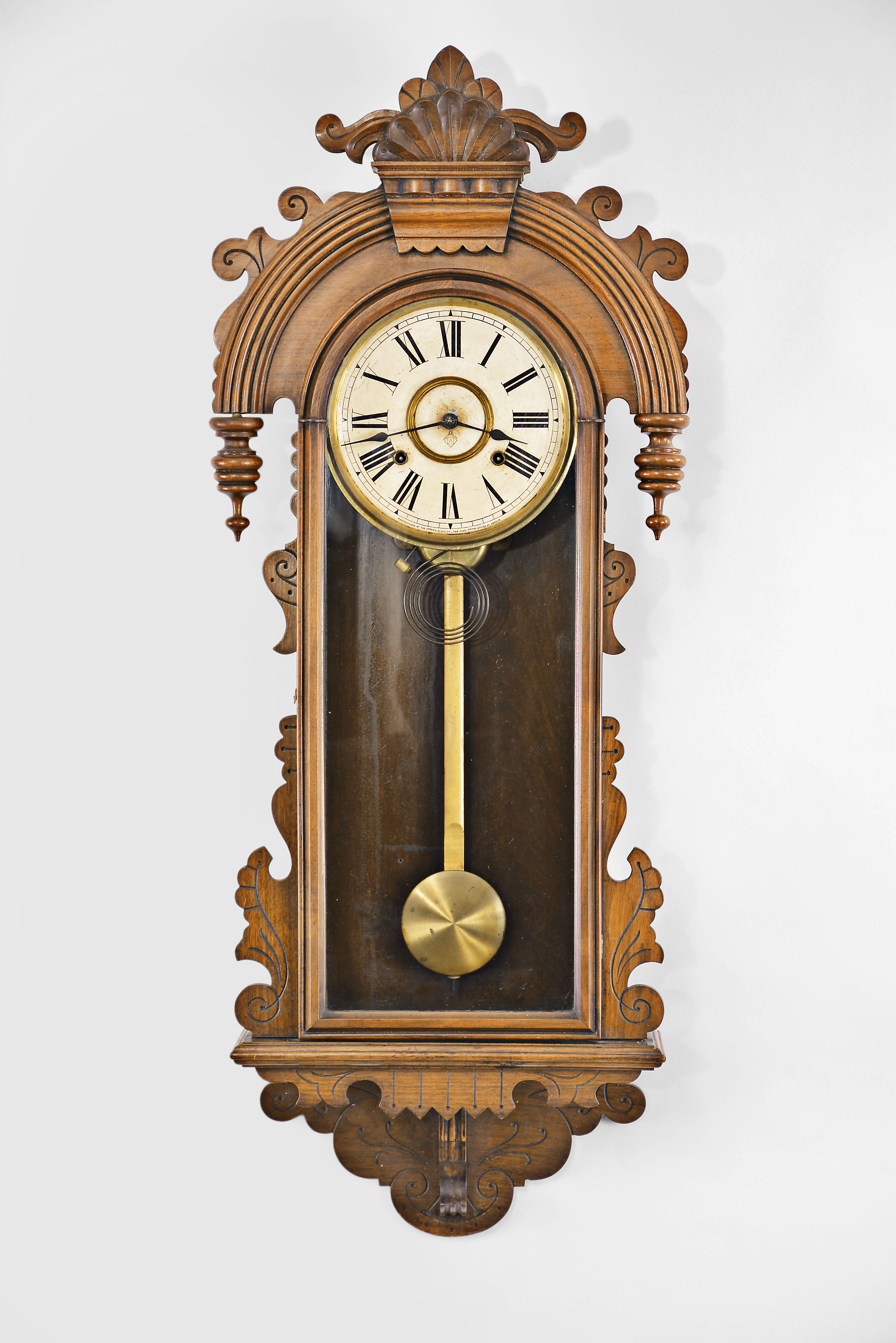Ansonia Clock Co., New York, "Queen Isabella" wall hanging clock with a spring driven 8 day time and half hour strike in a walnut case. — Antique Clocks Price Guide