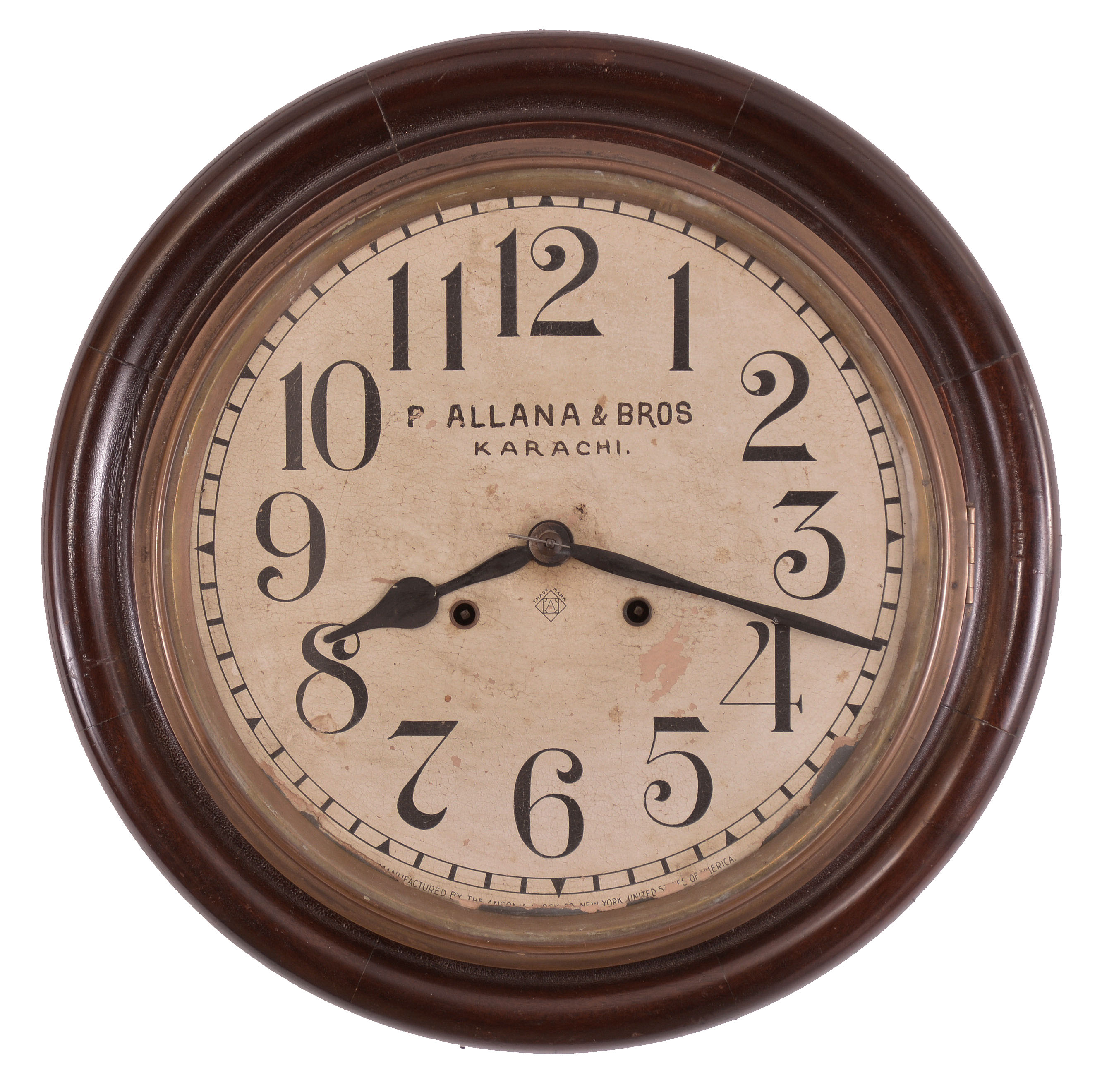 Clocks- 2 (Two): (1) Ansonia Clock Co., New York, "Gresham" wall hanging gallery clock with a 12 inch dial, dial reading "P. Allana & Bros / Karachi." and a spring driven 8 day time and strike movement in a finished mahogany case. c1894. (2) Seth Thomas Clock Co., Thomaston, Conn., "Office No. 5" wall hanging clock with a spring driven 8 day time and strike movement in an oak case. c1904. — Antique Clocks Price Guide