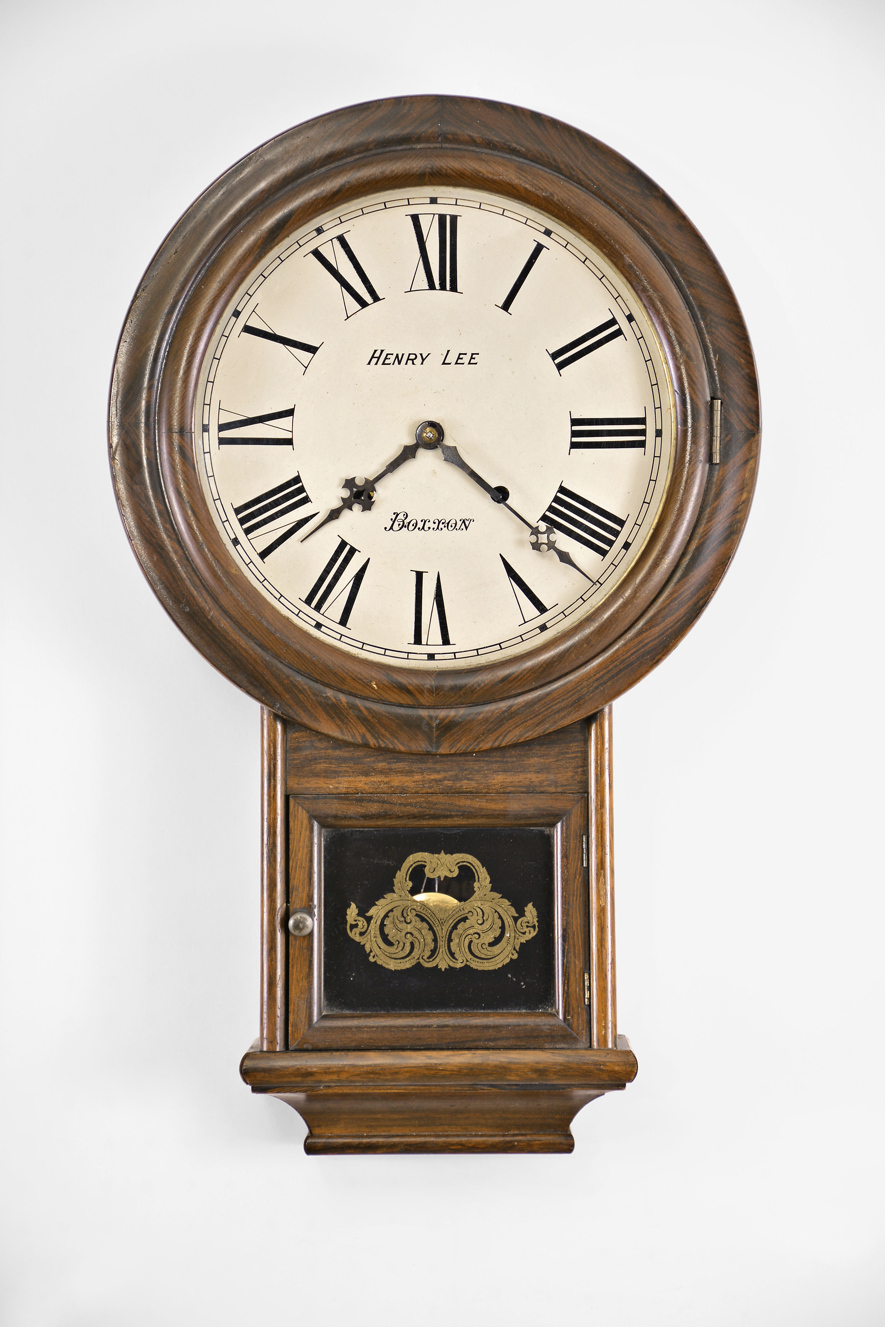 Welch, Spring, & Co., Forestville, Conn., "Round Head Drop" wall hanging clock with a spring driven 8 day time and strike movement with a painted dial reading "Henry Lee / Boxxon" in a rosewood case. — Antique Clocks Price Guide