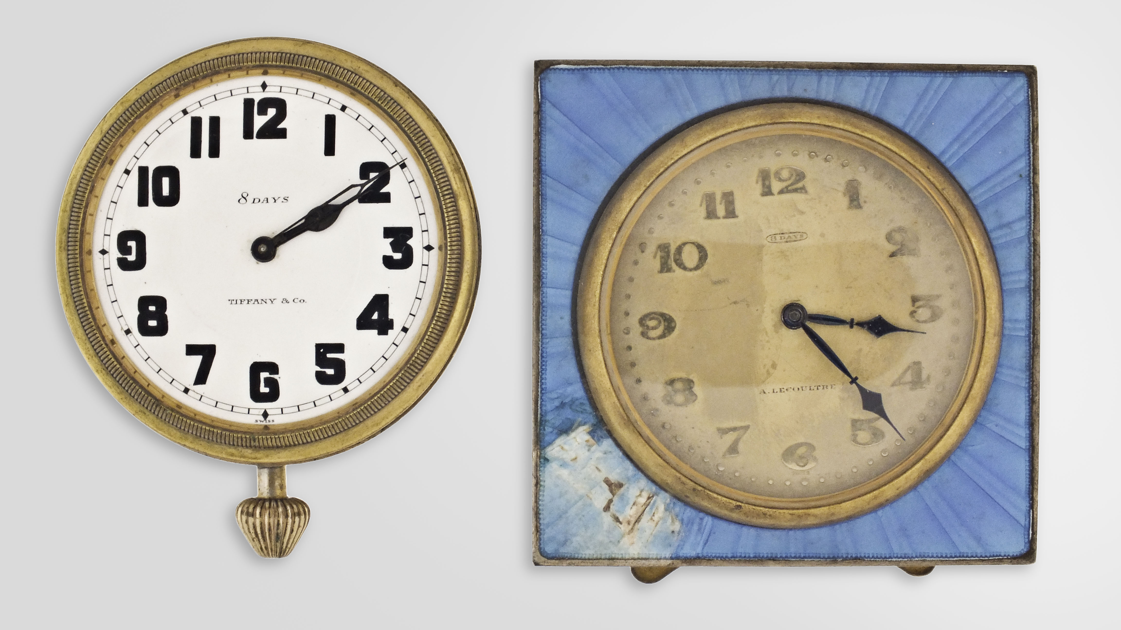 Desk or nightstand clocks- 2 (Two): the first signed A. LeCoultre, 8 day, 7 jewel nickel movement, Arabic numeral metal dial, square blue guilloche enamel case with easel back, 2 5/8 in sq., the other an Octavia Watch Co. for Tiffany & Co., 8 day, 15 jewel nickel movement, Arabic numeral white enamel dial, gilt open face case, lacking stand, 2 1/4in — Antique Clocks Price Guide