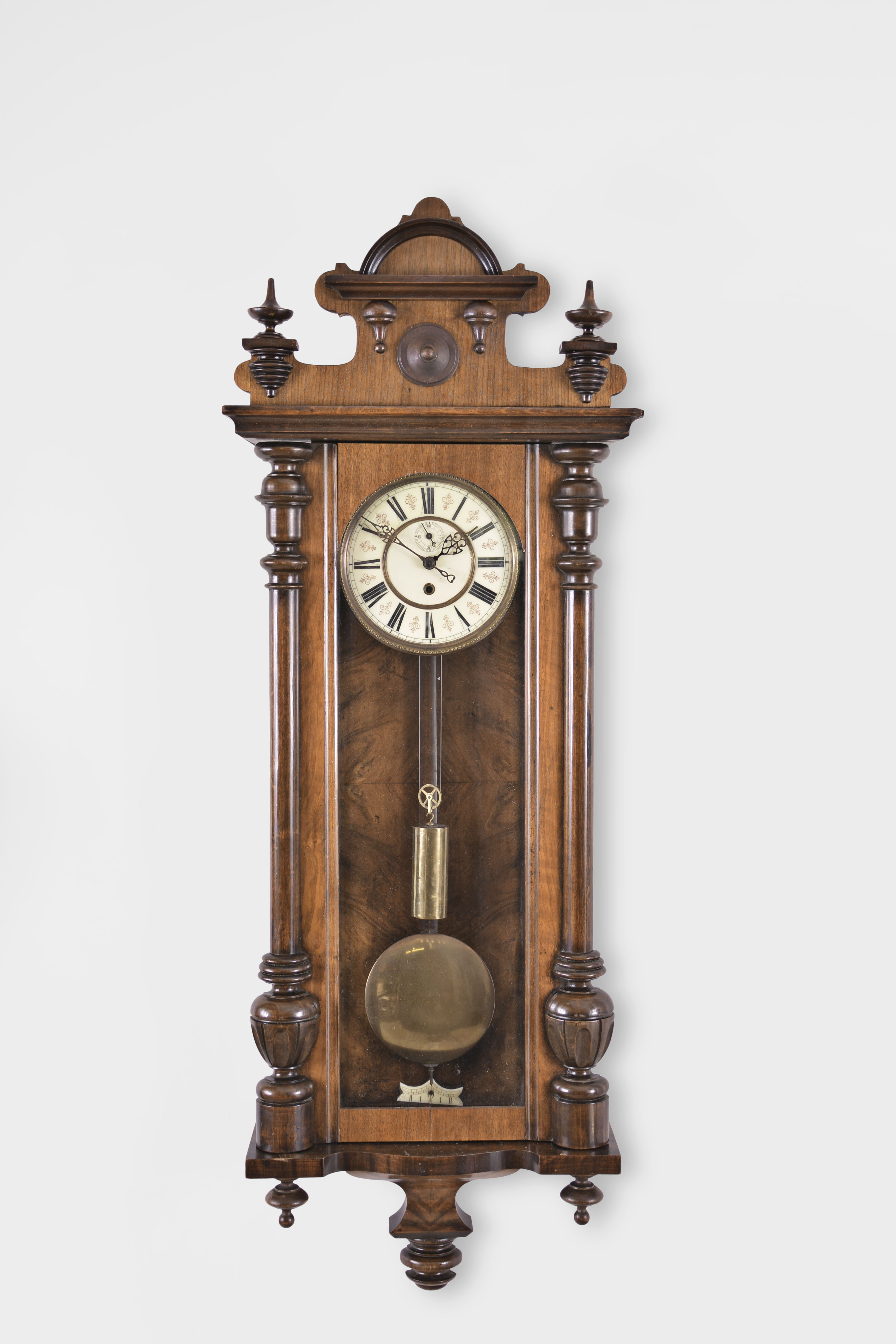 Clocks- 2 (Two): (1) A. Willmann & Co., Freiberg, Germany, Vienna style regulator, 8 day, time only, weight driven movement in a walnut case with cream porcelain dial, c1880; (2) Germany or Austria, Vienna style regulator, 8 day, time only, weight driven movement in walnut veneer case with ebonized accents and two-piece enamel dial, c1885. — Antique Clocks Price Guide