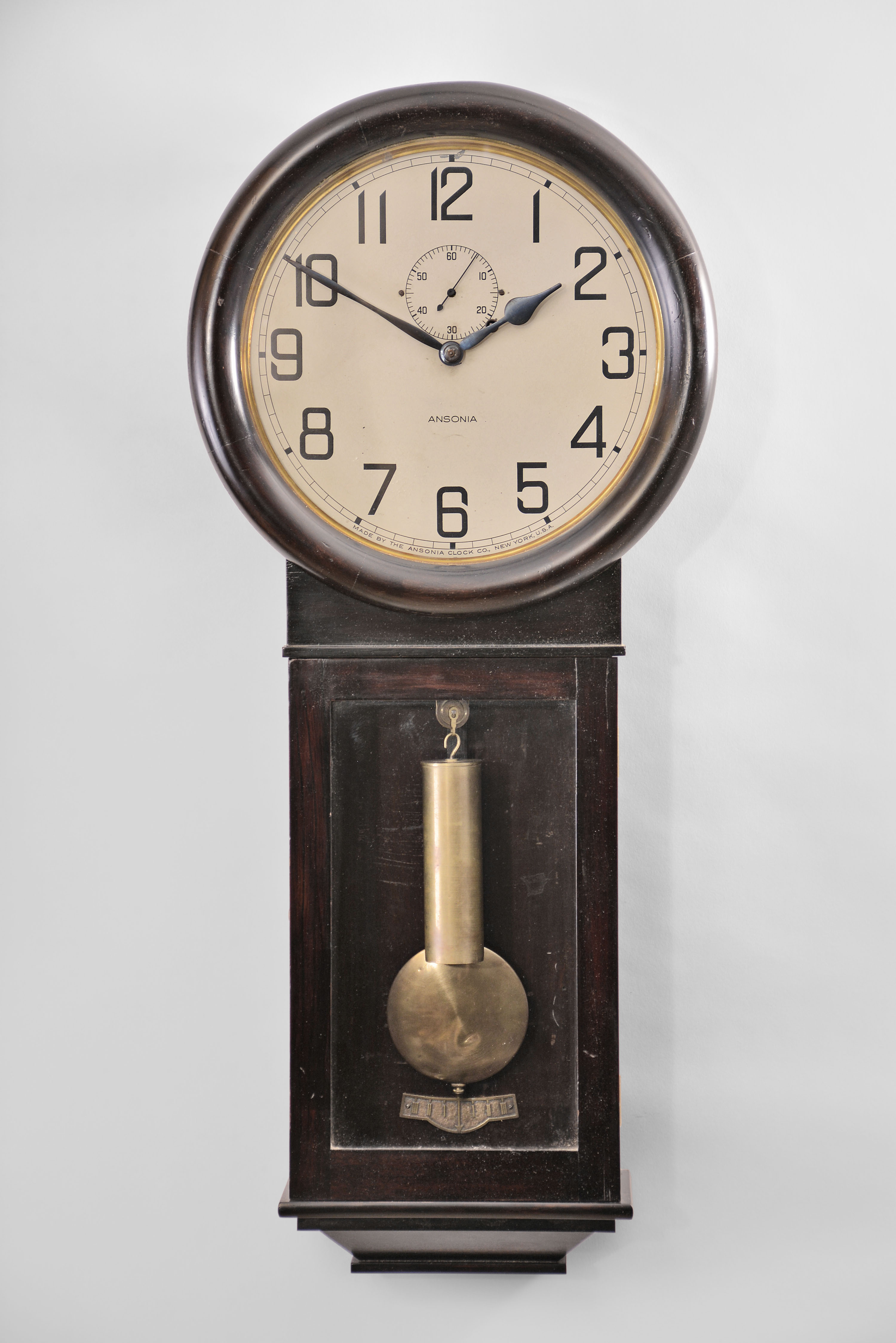 Ansonia Clock Co., New York, "Standard Regulator" wall clock with a weight driven 8 day timepiece movement in a darkly finished mahogany case. — Antique Clocks Price Guide