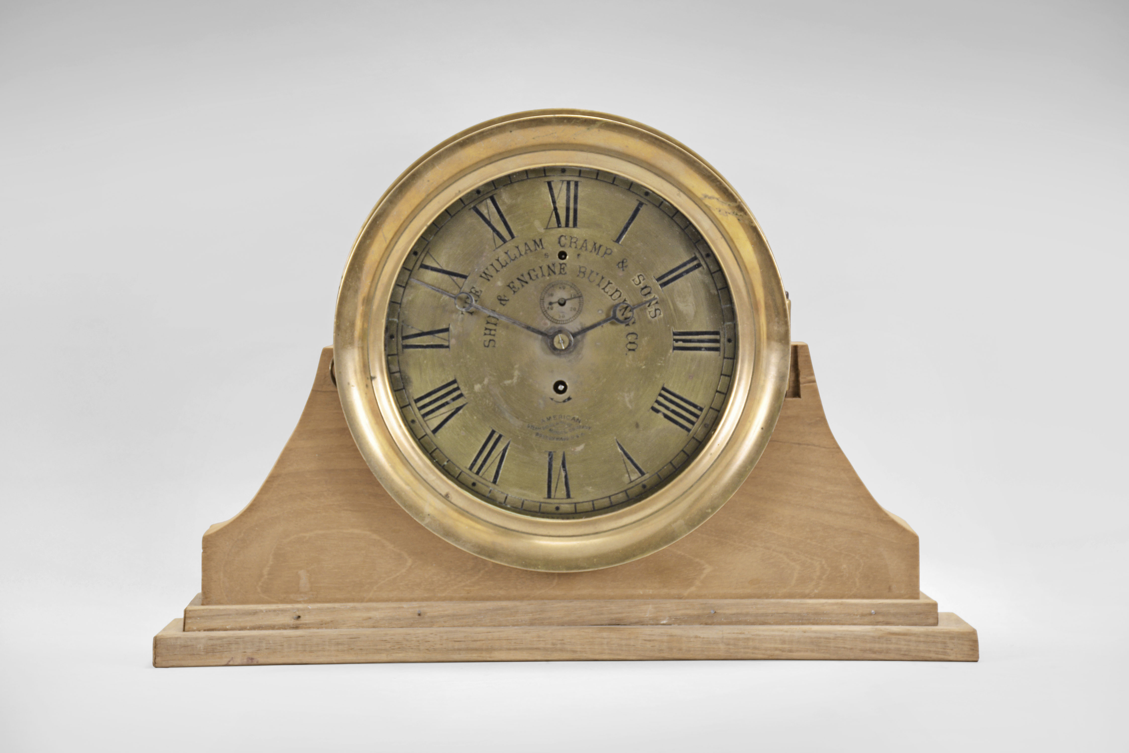E. Howard & Co., Boston, Mass., for American Steam Gauge & Valve Manufacturing Co. Boston, Mass., "No. 69" style marine clock, round brass case with mounting flange, 8.5 inch Roman numeral brass dial, blued steel moon hands, signed, 8 day nickel damascened movement, serial #2117, dial #3083 NG, case #3083 — Antique Clocks Price Guide