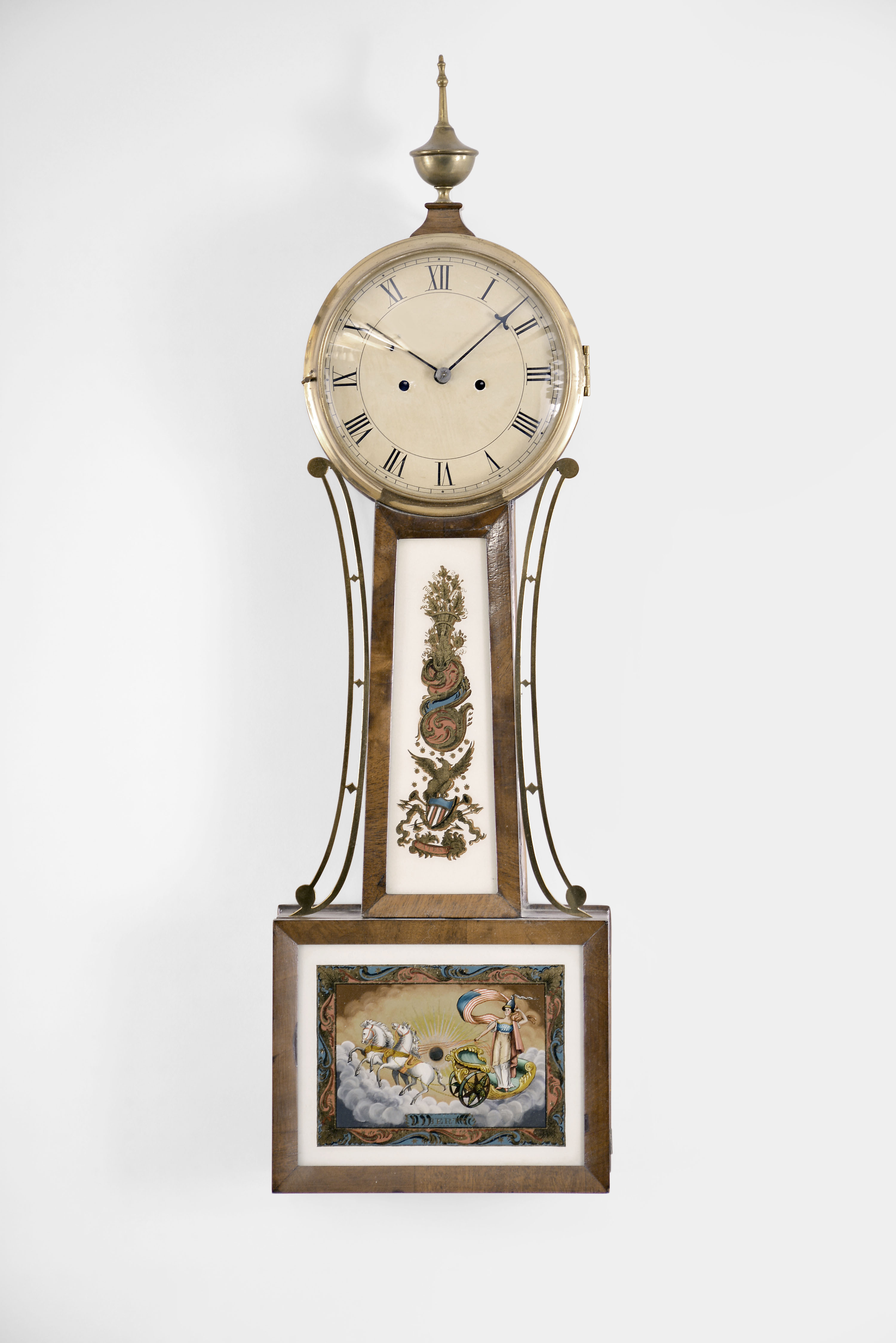 Massachusetts, possibly Stephenson, Howard & Davis, Boston, Mass. 8 day, time and strike weight brass movement patent or banjo timepiece. The use of a three pillar design with two access holes through the front plate leads to the attribution. See "Willard's Patent Time Pieces by Paul J. Foley", Pg. 155. — Antique Clocks Price Guide