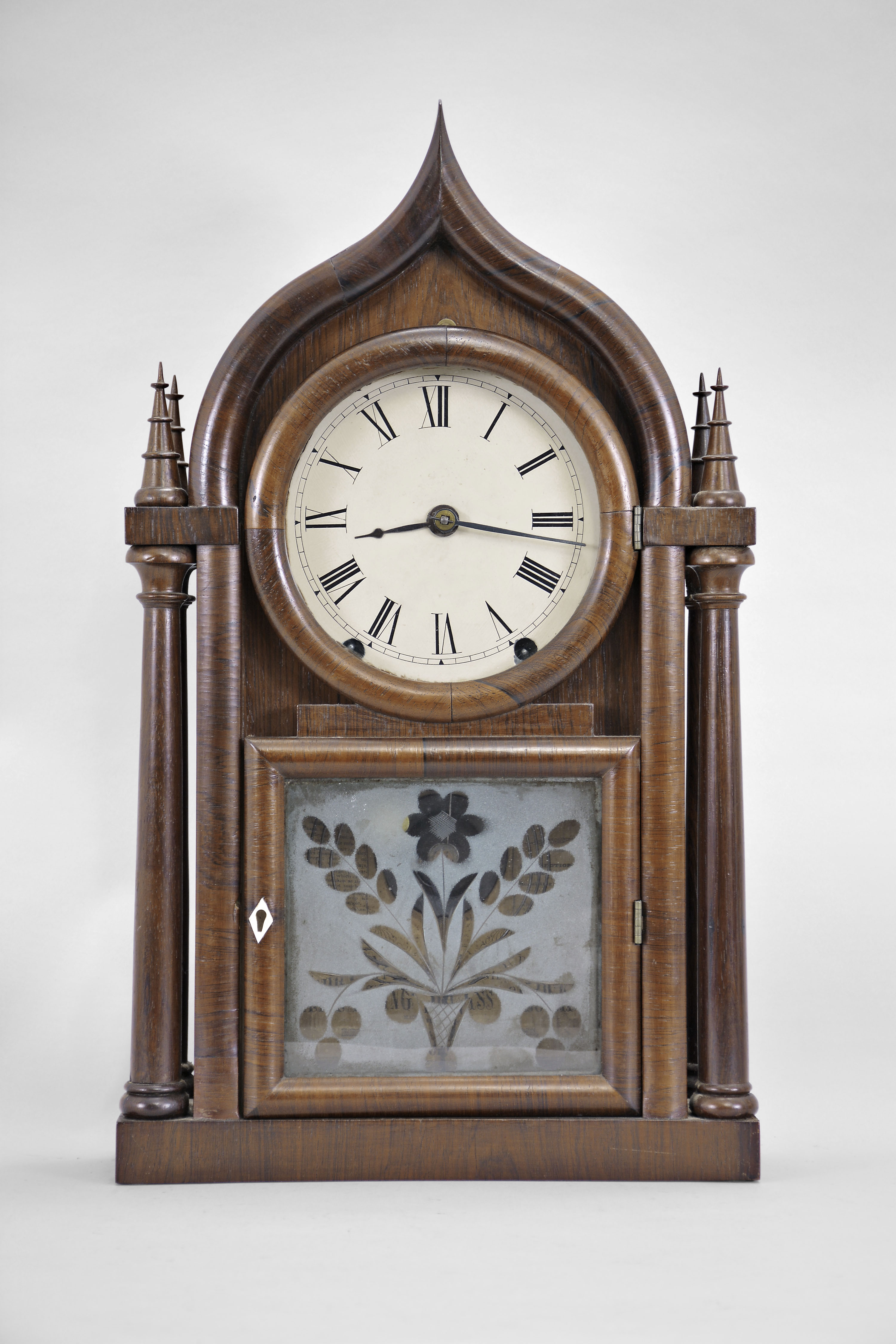 Brewster & Ingraham, Bristol, Conn., 8 day, time and strike brass spring brass movement four column O.G. Gothic or onion top shelf clock. — Antique Clocks Price Guide