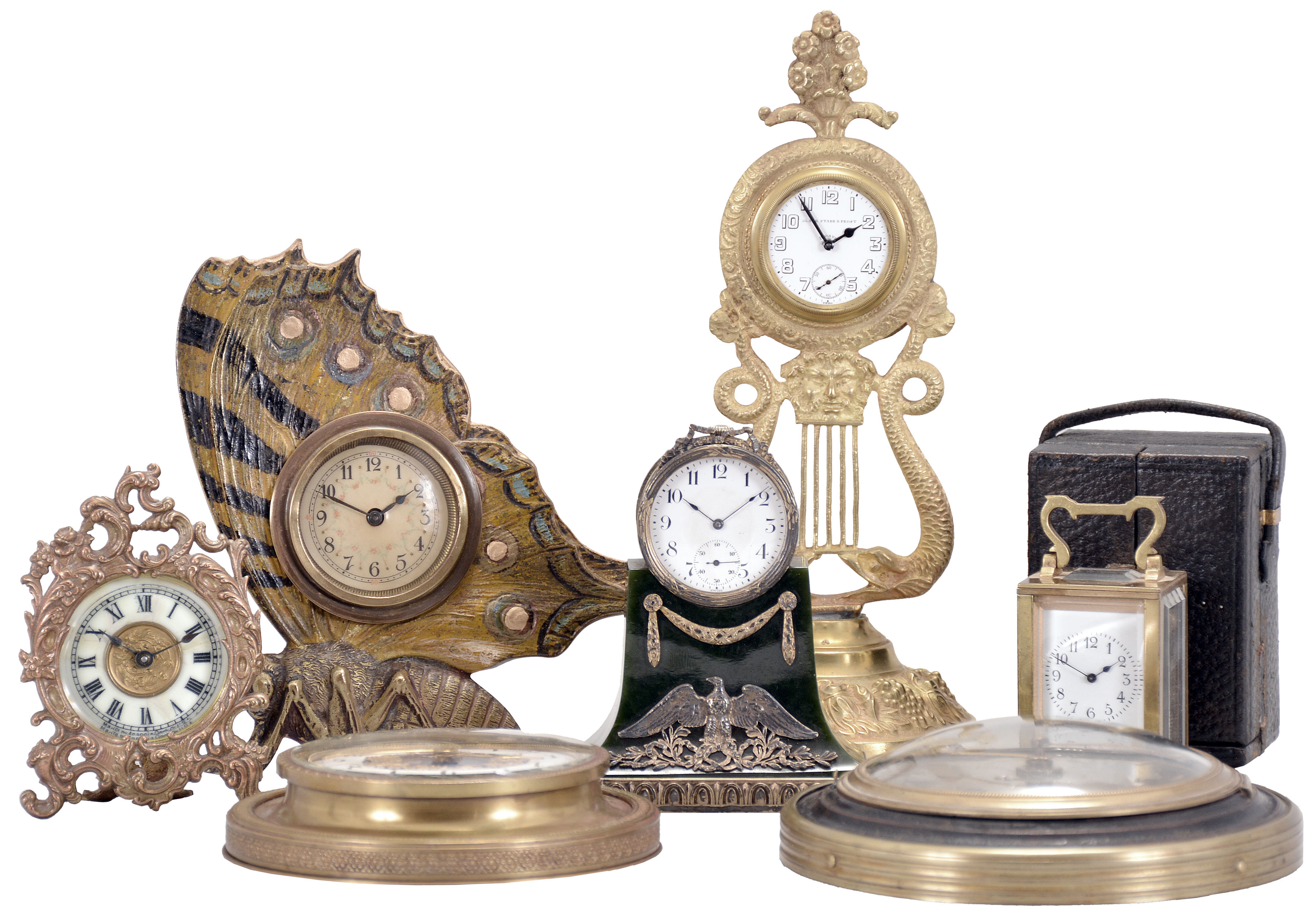 Clocks- 7 (Seven) Desk and Small Wall: lot includes: time only miniature carriage clock in case; Ansonia desk clock with metal case and porcelain dial; pocket watch holder with serpents and a Swiss watch permanently installed; watch movement in miniature drum-head mounted on green stone base; novelty clock in the form of a butterfly; wall clock with silvered dial and Swiss watch movement; wall clock with white enamel chapter ring, blue dial center with a pair of static jacquemart figures. — Antique Clocks Price Guide
