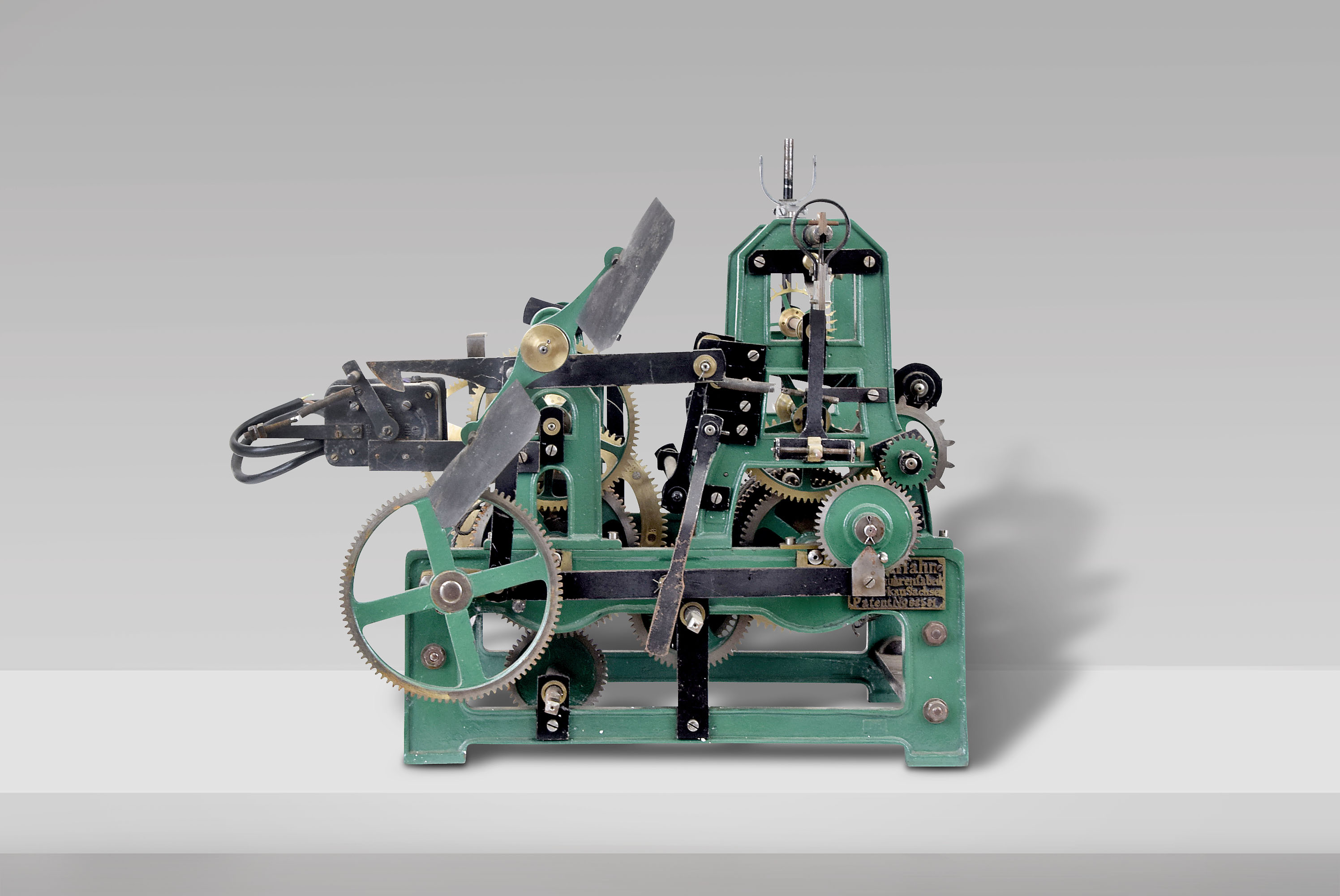 Max Han, Thurmuhrenfabrik Zickau Sachsen, German tower clock, time and strike, weight driven movement with anchor escapement in a green painted cast iron frame with maker's signature and switch for electrically winding weights, Patent No. 88581 — Antique Clocks Price Guide