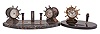 Clocks- 2 (Two): (1) Waterbury Clock Co., Waterbury, Conn., "Desk Set No. 1", 8 day, time only, spring driven jeweled movements in a yacht wheel form metal case on a black onyx base with pen holder, c1929; (2) Waterbury Clock Co., Waterbury, Conn., "Desk Set No. 3", 8 day, time only, spring driven jeweled movements in a yacht wheel form case on a black marble base with pen holder, thermometer, and barometer, c1929