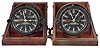 Clocks- 2 (Two) Message Center: Chelsea Clock Co., Boston, "U.S. Army Clock Message Center, Mark 2" military timepieces, 8 day, time only, spring-driven balance wheel movements in black phenolic cases with black dials showing 12 and 24 hours, center seconds, and secondary hour hand to show GMT, all in tilt-out wooden carrying cases with leather straps.