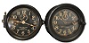 Clocks- 2 (Two) Seth Thomas Marine: (1) Seth Thomas Clock Co., Thomaston, Conn., for U.S. Navy, "Mark I- Deck Clock", 8 day, time only, spring-driven rear-wind movement in a black phenolic case with a hinged bezel, 6 inch black dial with white Arabic numerals, subsidiary seconds, and white spade hands, dated 1942. (2) Seth Thomas Clock Co., Thomaston, Conn., deck clock, 8 day, time only, twin spring-driven movement in a black phenolic case with a hinged bezel, 6 inch black dial with white Arabic numerals, subsidiary seconds, and white spade hands.
