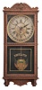 Clocks- 2 (Two): (1) William L. Gilbert, Winsted, Conn., "Observatory" hanging clock, 8 day time and simple calendar, spring driven movement in an oak case, c1913; (2) E. Ingraham, Bristol, Conn., "Yankee Clipper" banjo clock, 8 day, time and strike, spring driven movement in a wood case with nautical theme, c1934.