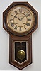Ansonia Clock Co., New York, "Regulator A" wall clock, 8 day, time and strike, spring driven movement in a walnut case with paper dial with subsidiary seconds and blued steel hands.