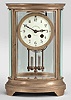 Charles Hour, Paris, for Bigelow, Kennard, & Co., Boston, crystal regulator, 8 day, time and strike, spring driven pendule de Paris movement with Brocot escapement and compensating pendulum in an oval form glazed gilt brass case with cream colored enamel dial with arabic numerals and blued steel hands.