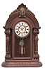 E. N. Welch, Forestville, Conn., unknown model, 8 day, time and strike, spring driven movement in a walnut case with full carved columns.