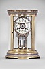 S. Marti & Cie, Paris, France, oval crystal regulator, 8 day, time and strike, spring driven pendule de Paris movement in a gilt brass case with four curved beveled glasses, cloisonne trim in bands around the case top and bottom, dial, and on the frame of the compensating pendulum, cream colored enamel dial with Arabic numerals, gilt hands, and double-vial pendulum.