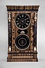 New Haven Clock Co. (For the National Calendar Clock Co.), New Haven, Conn, "Column Calendar Clock" with a spring driven 8 day time and strike movement with a simple calendar mechanism in a veneer imitation grained case with gilt capped faux painted tortoise shell columns.