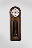 E. Howard & Co., Boston, Mass., "No. 12 Regulator", wall clock, 8 day, time only, weight driven movement with a meter long compensated mercury pendulum with glass jar, in a walnut case with a painted metal dial and reverse painted tablet and on a purpose made special order base from the factory that allows the clock to stand on the floor.