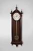 E. Howard & Co., Boston, Mass., "No. 71 Regulator" wall clock, 8 day, time only, weight driven movement with deadbeat escapement in a walnut case with ebonized trim, gilded wooden pendulum rod, damascened pendulum bob, painted metal dial and seconds bit