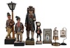 Novelties- 7 (Seven): lot includes: carved figure leaning on a lamp post which holds a small incandescent bulb; plastic battery-operated whistler figure; small clock peddler figure with quartz watch movement; large cast clock peddler figure with German novelty clock movement; Japanese swinging doll clock under glass; German made birdcage clock; Japanese made birdcage clock.