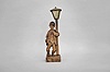 Karl Griesbaum, Triberg, Germany, "Drunkard" whistling figure, spring driven brass movement driving bellows, cam-controlled whistle, and head-turning motion enclosed in hand carved wooden figure depicting an intoxicated man wearing an askew bowler hat who leans on a lamp post for support as he whistles a tune.